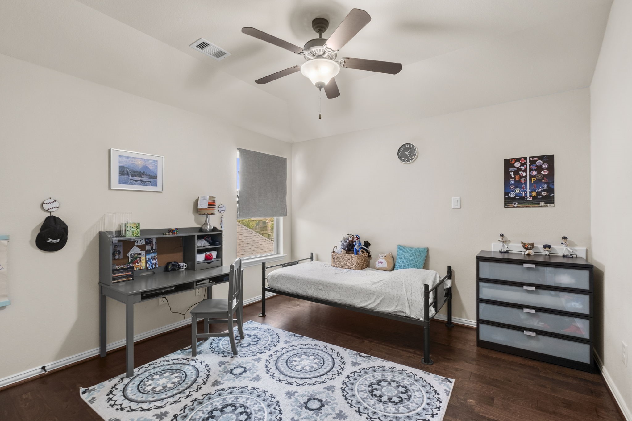 Spacious secondary bedroom upstairs also with wood floors.