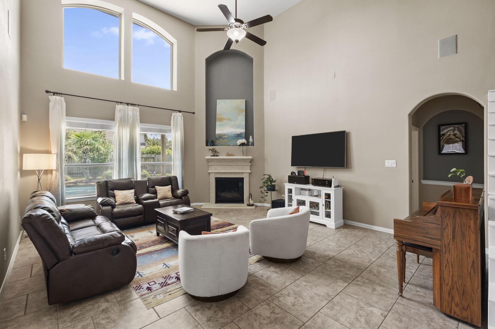 Spacious two story family room with lovely backyard views offering plenty of natural light.