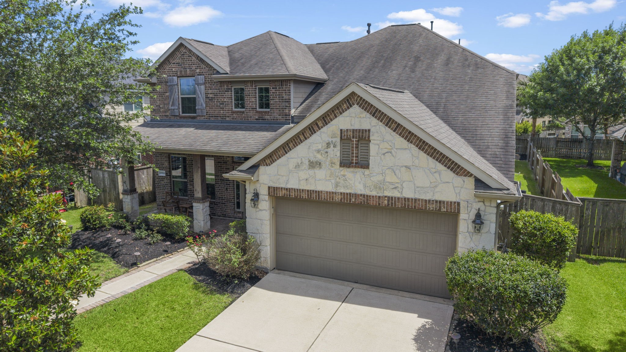 The blend of brick and stone & a cozy front porch makes this home a comfortable & enjoyable place to live!