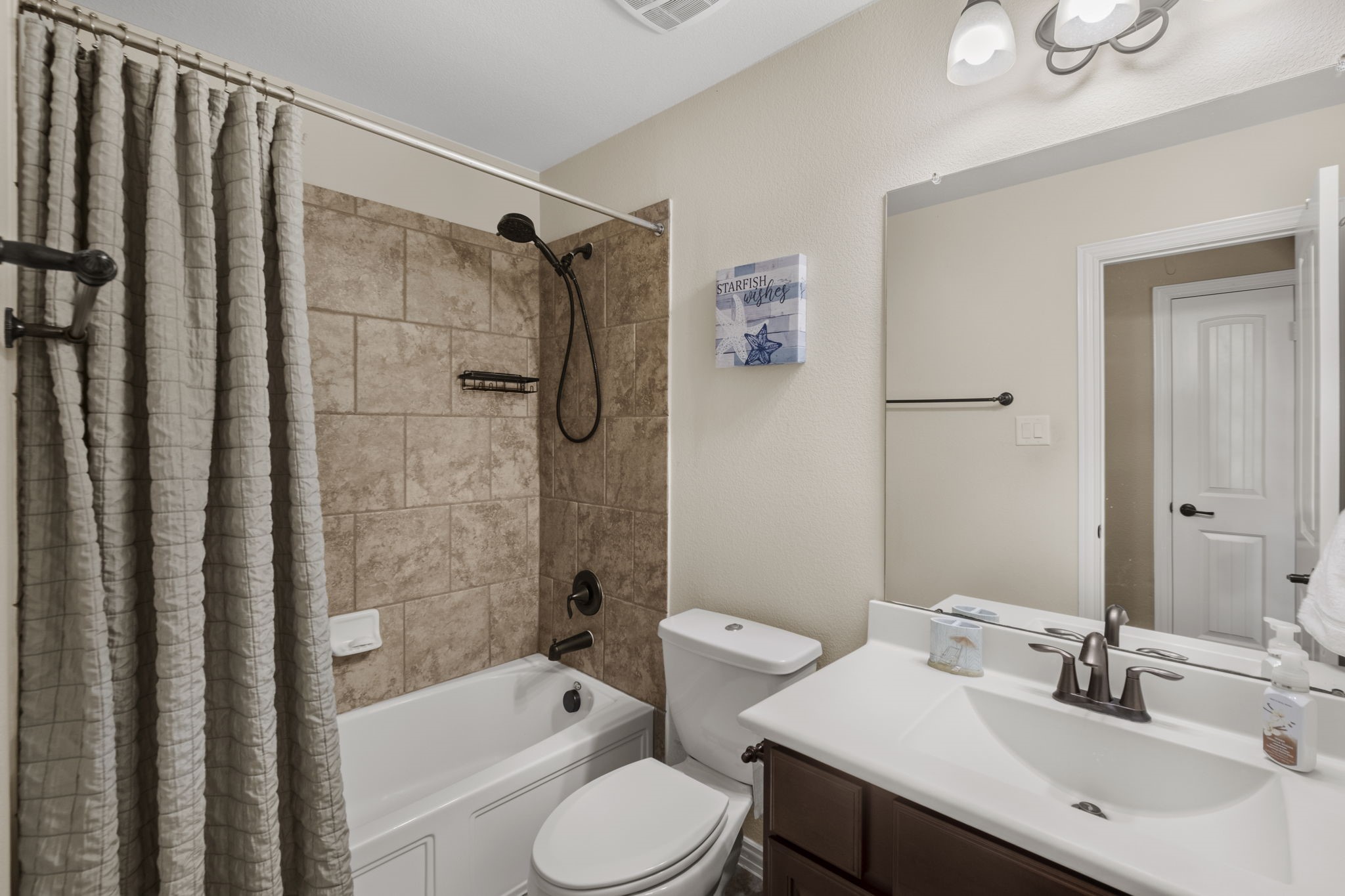 One of two full bathrooms upstairs.