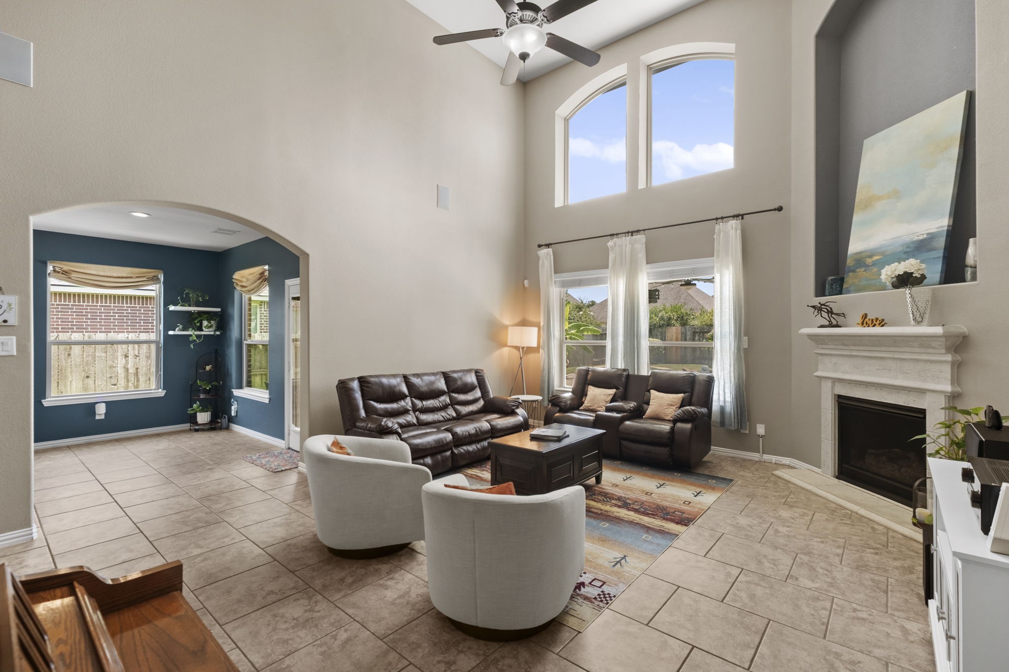 Soaring ceilings in this beautiful living room which flows right into the breakfast area.