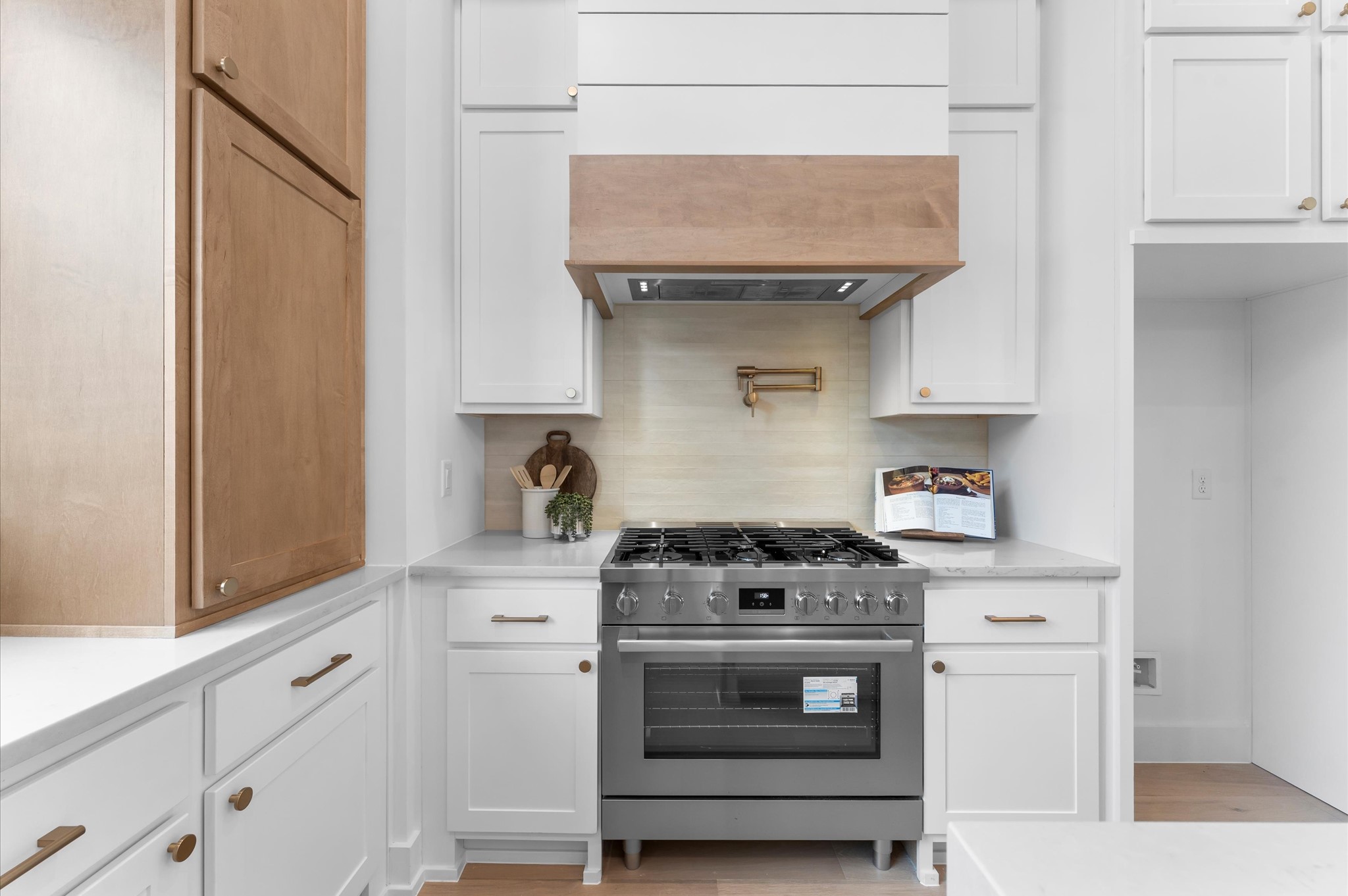 Kitchen provides plenty of cabinet, counter space and high end appliances.