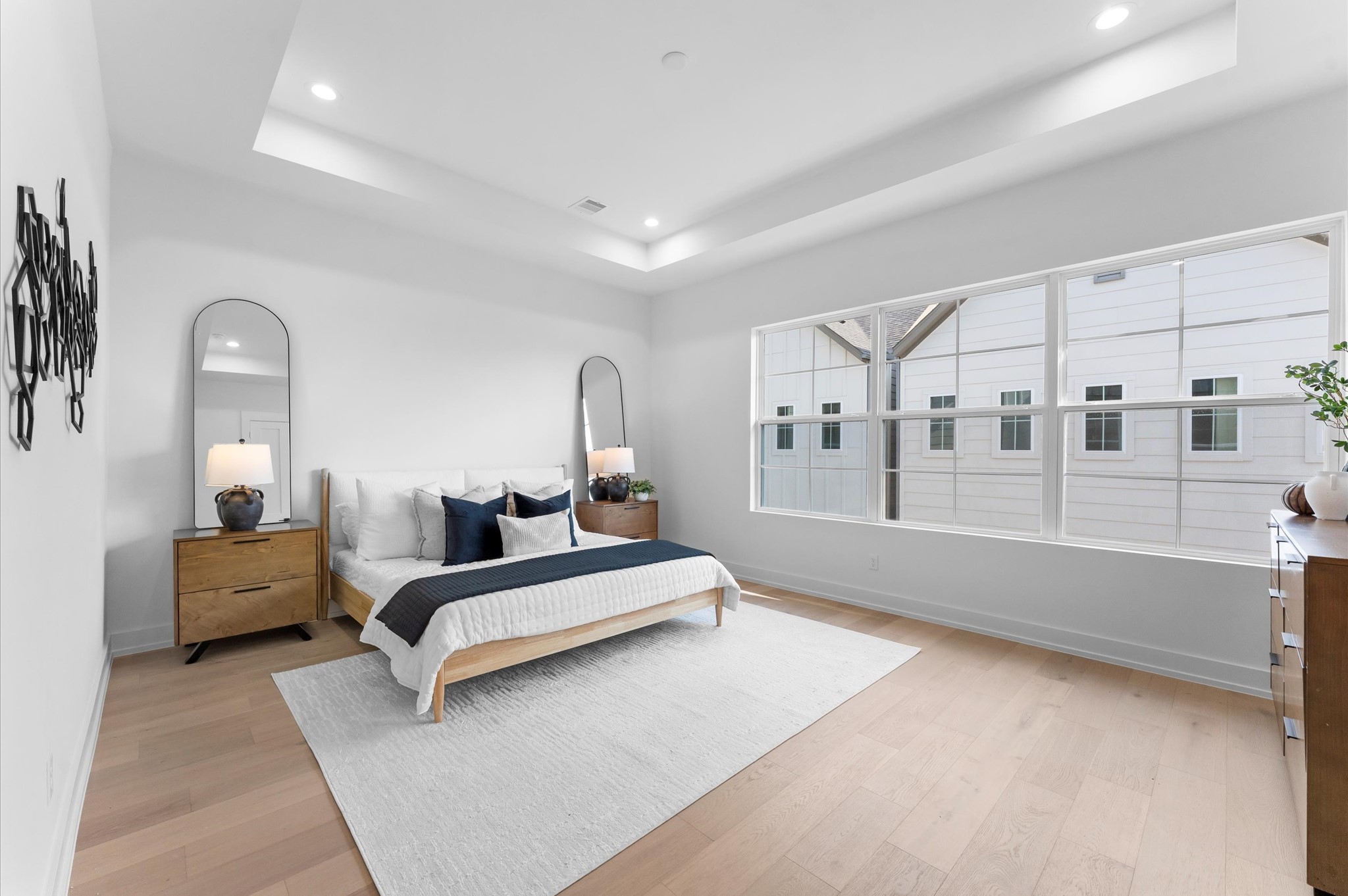 Oversized primary bedroom with tray ceiling is located on the third floor.