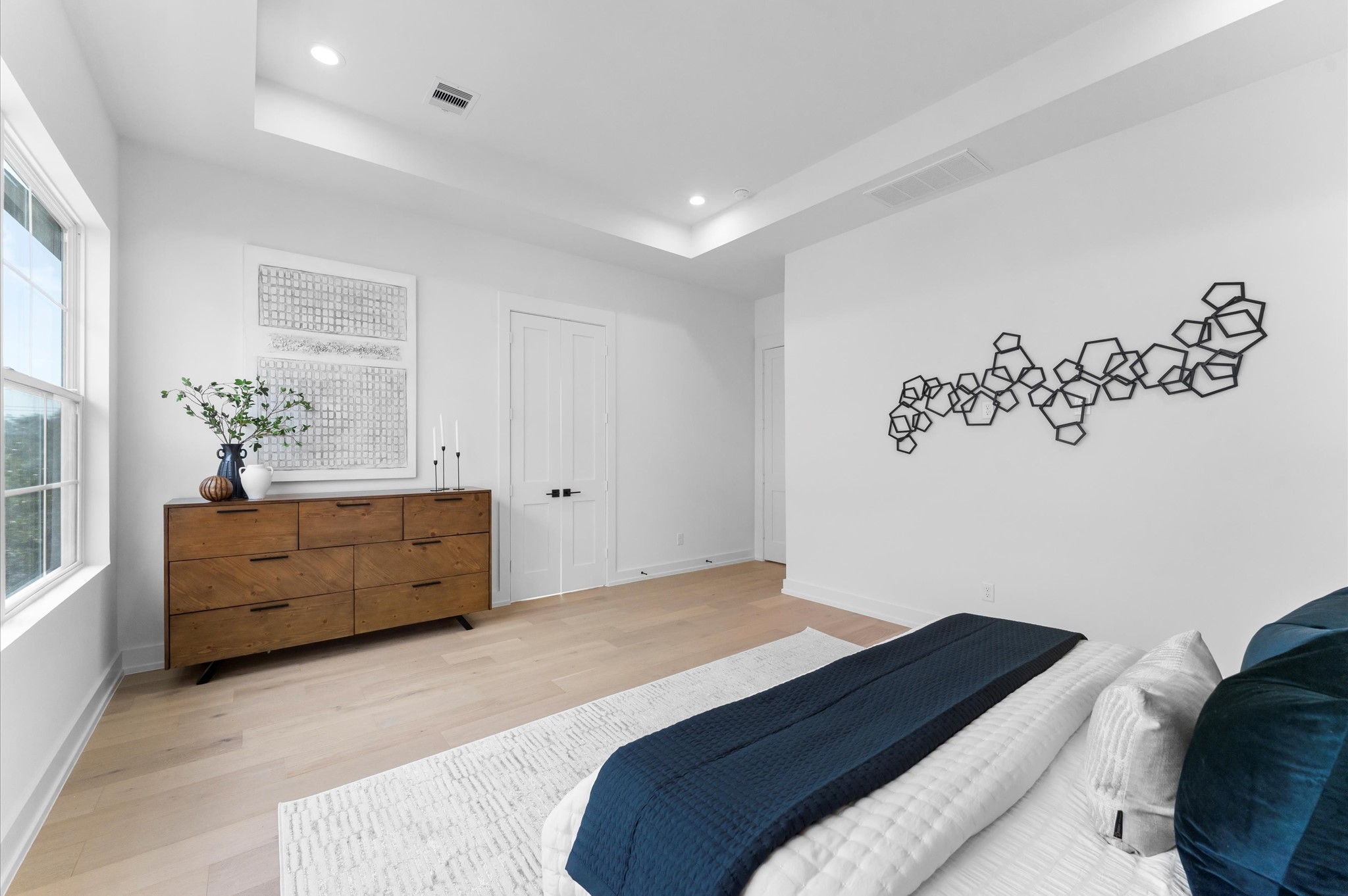 Primary bedroom is truly an owner's retreat.