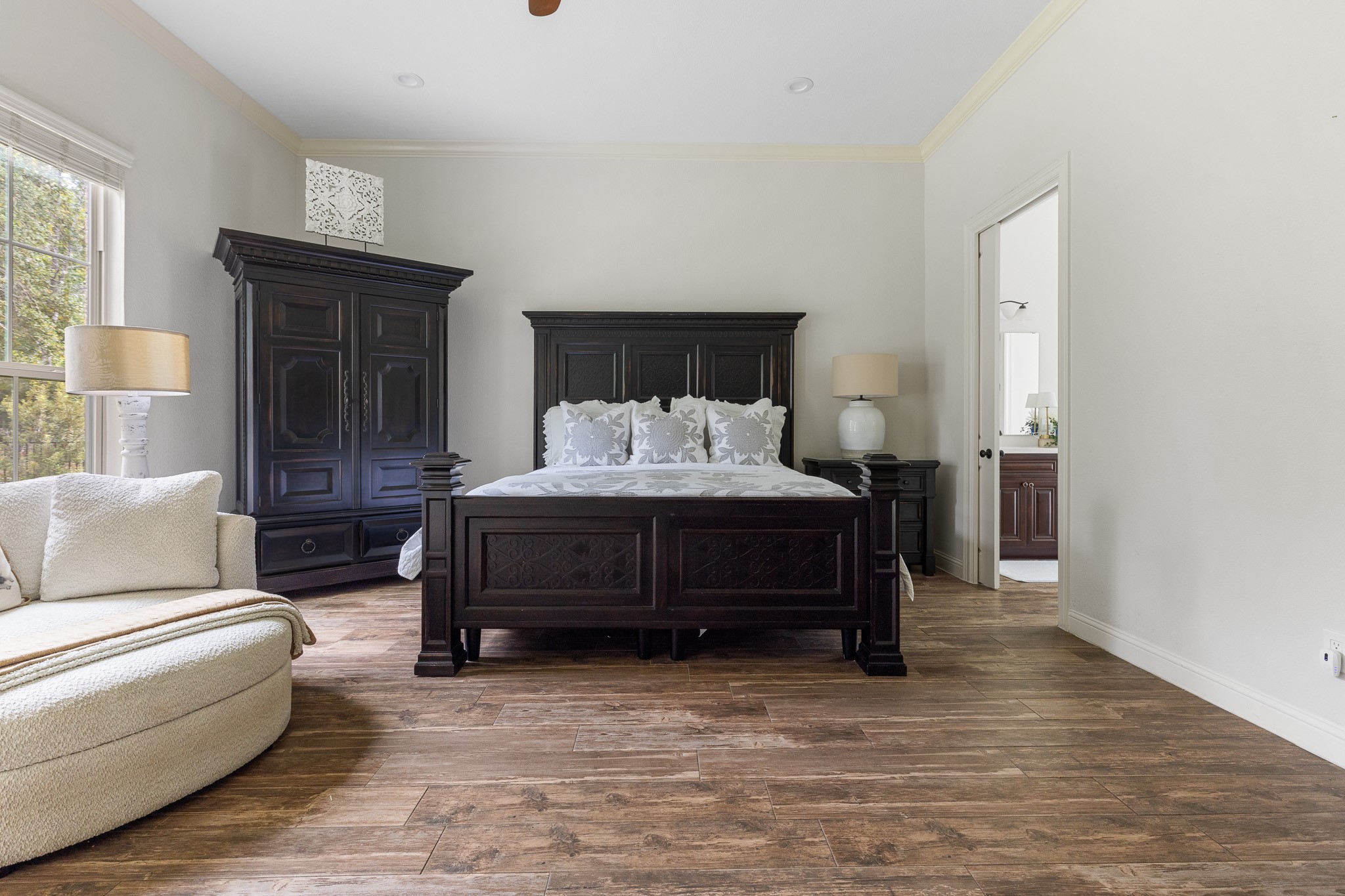 Primary Bedroom with ensuite and custom built ins, walk-in closet.