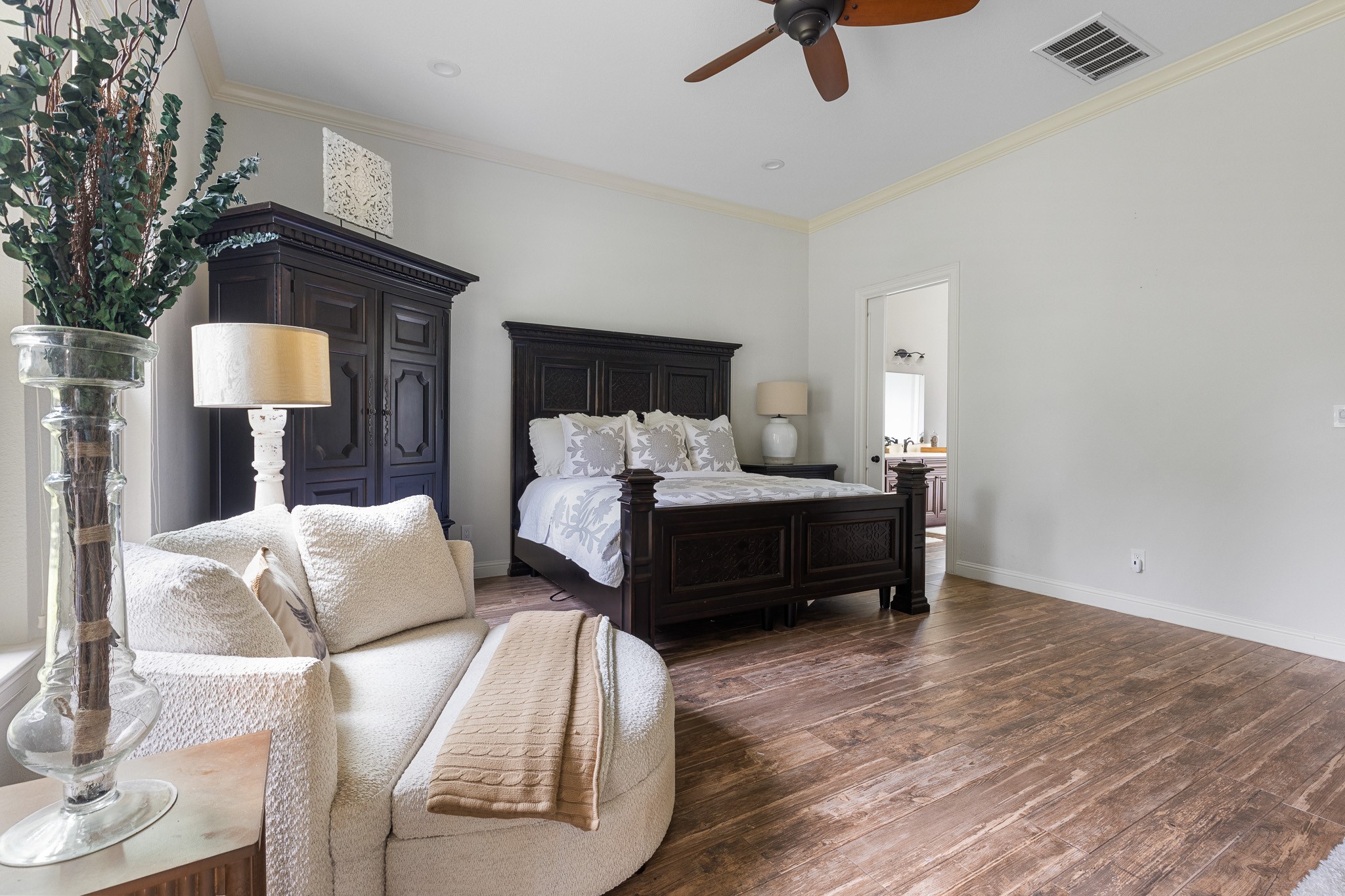 Primary Bedroom with sitting area and direct access to patio.