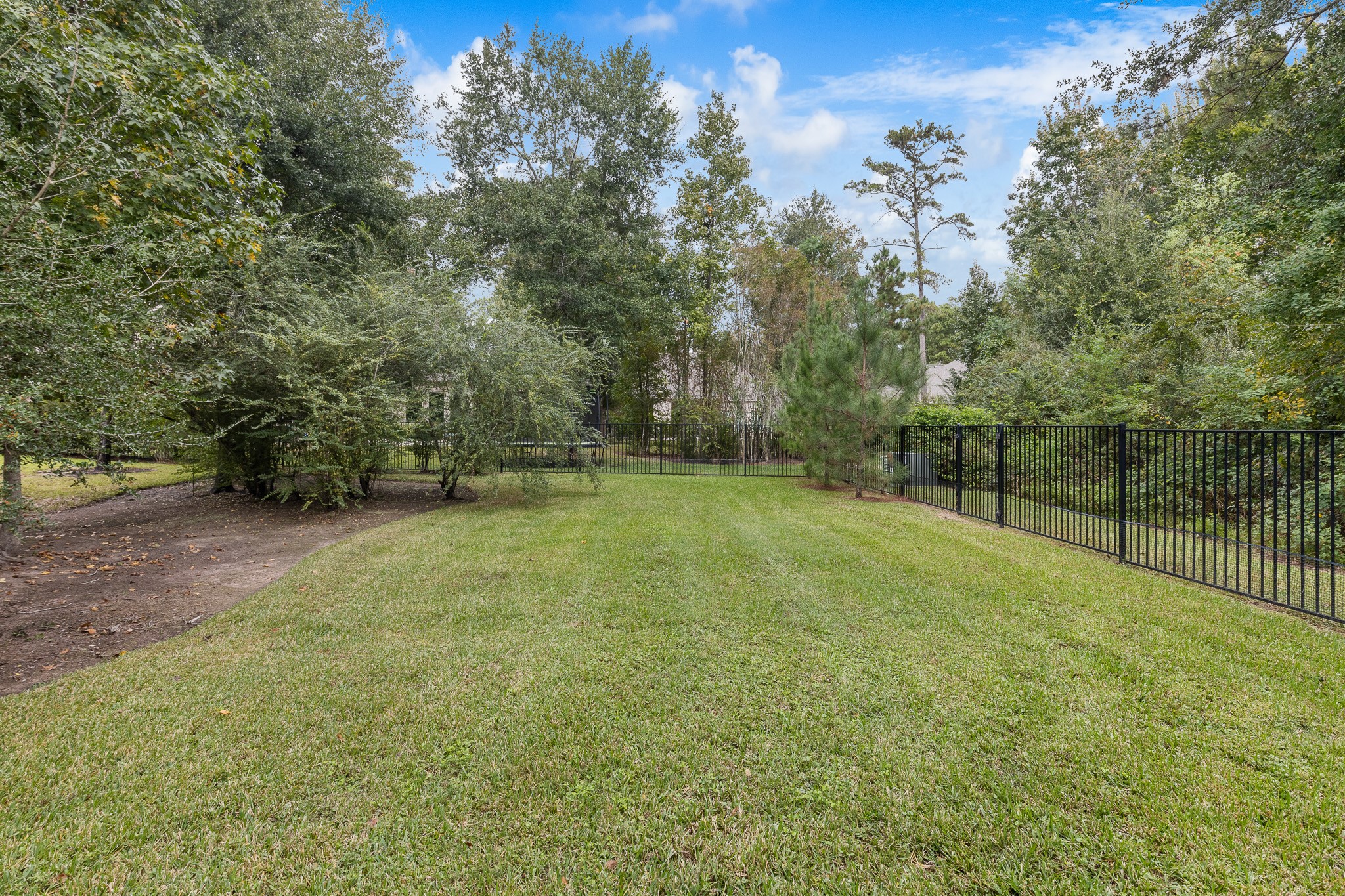 Wrought iron fencing, irrigation in front, back and sides.
