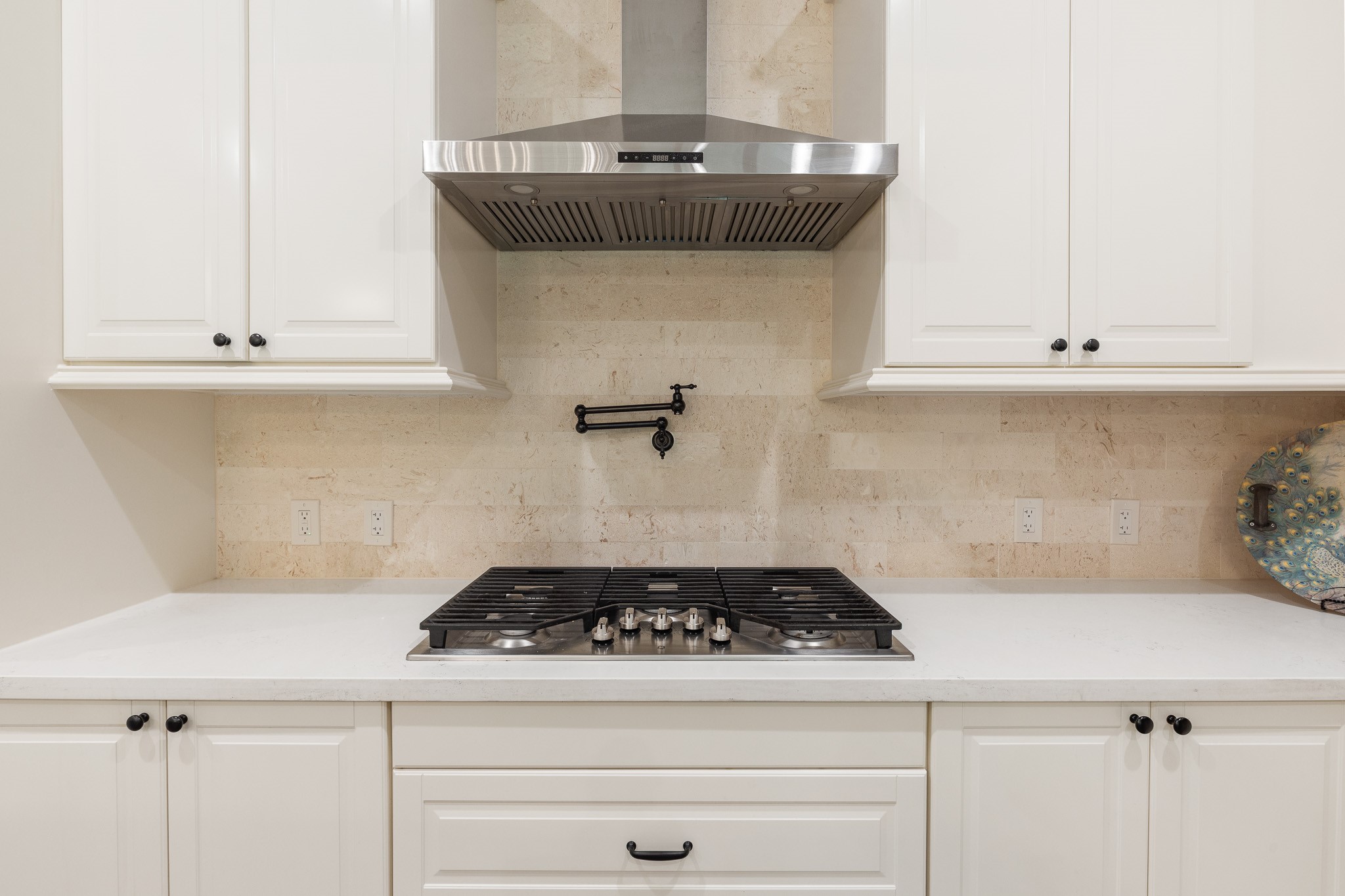Gas cooktop, hood and pot-filler.