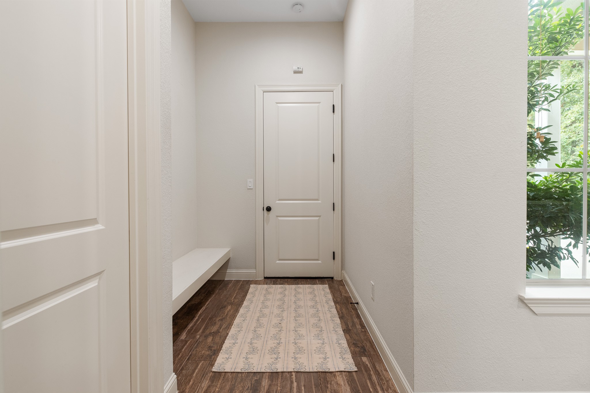 Mud room off of garage, spray foam insulation installed in the attic, significantly improving energy efficiency, temperature regulation and overall comfort.