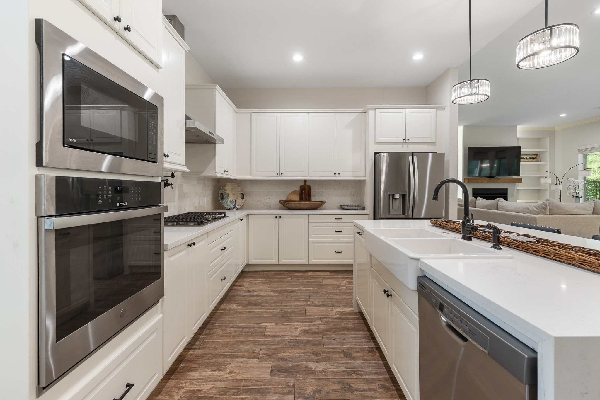 Kitchen with stainless steel appliances, Quartz waterfall island with breakfast bar.