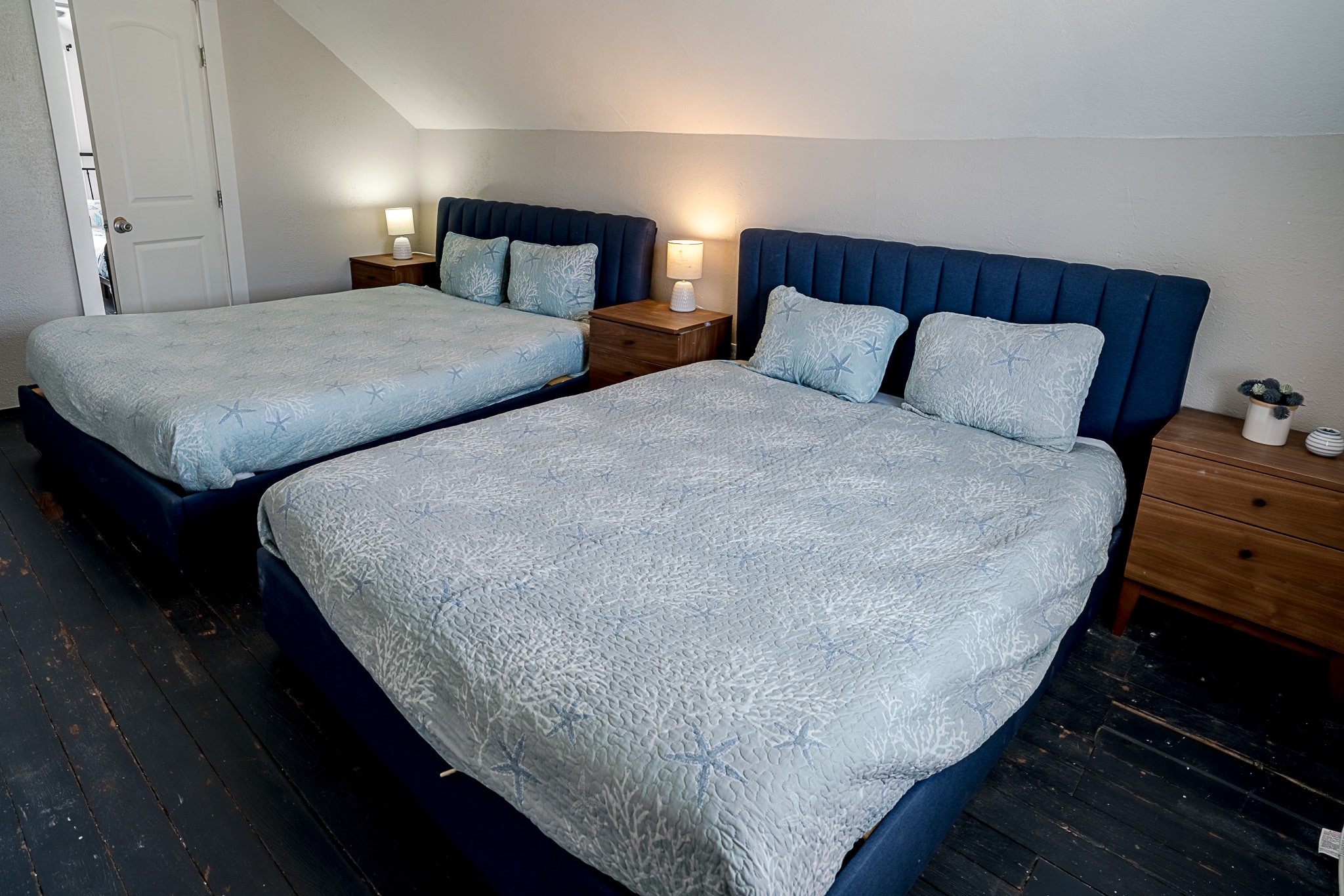 Second floor half story features two queen beds