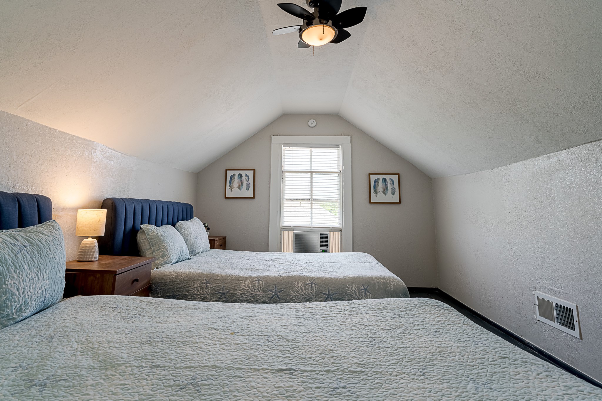 Second floor half story features two queen beds