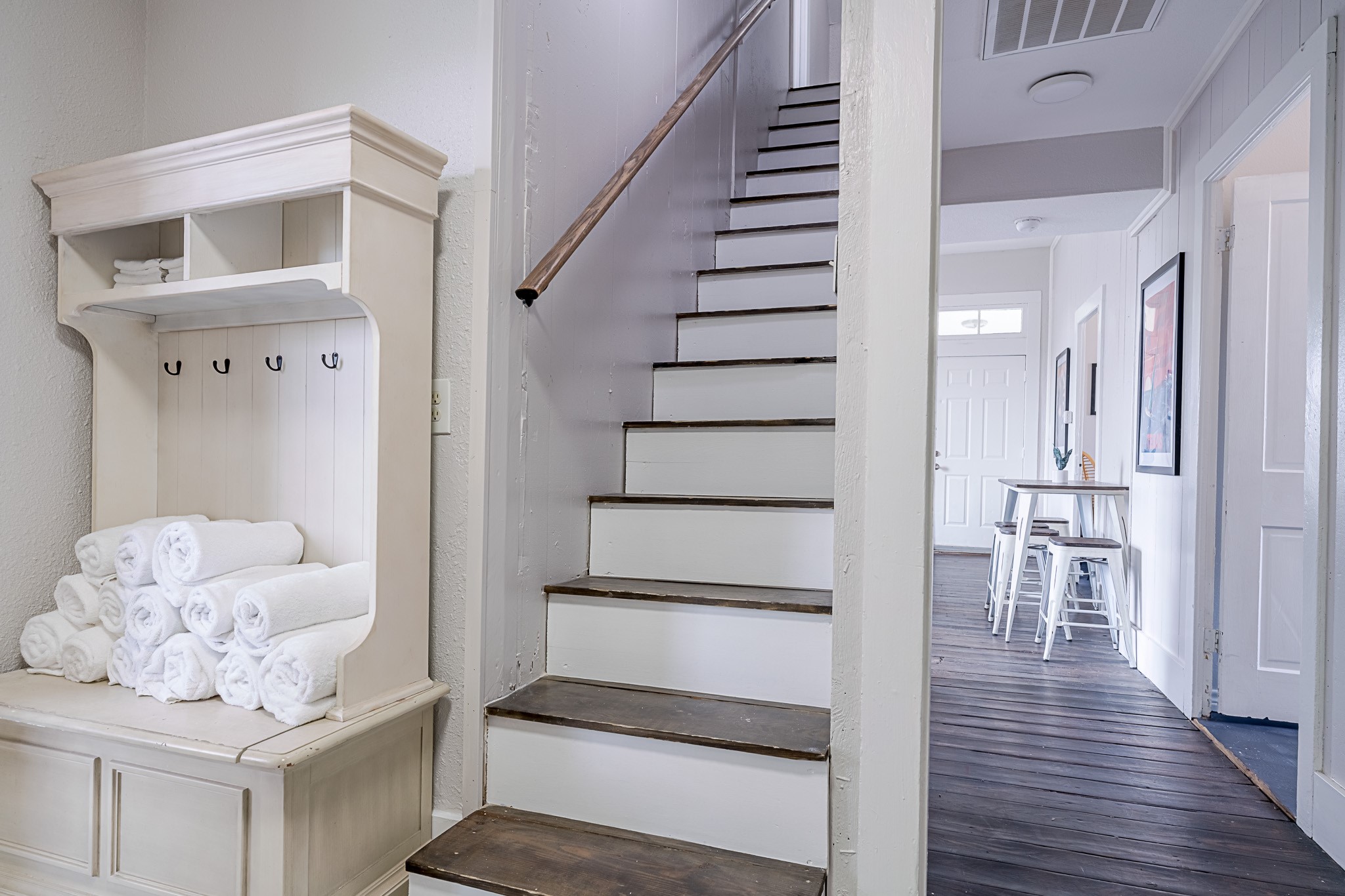 Stairs leading to more bedrooms on the second floor half story