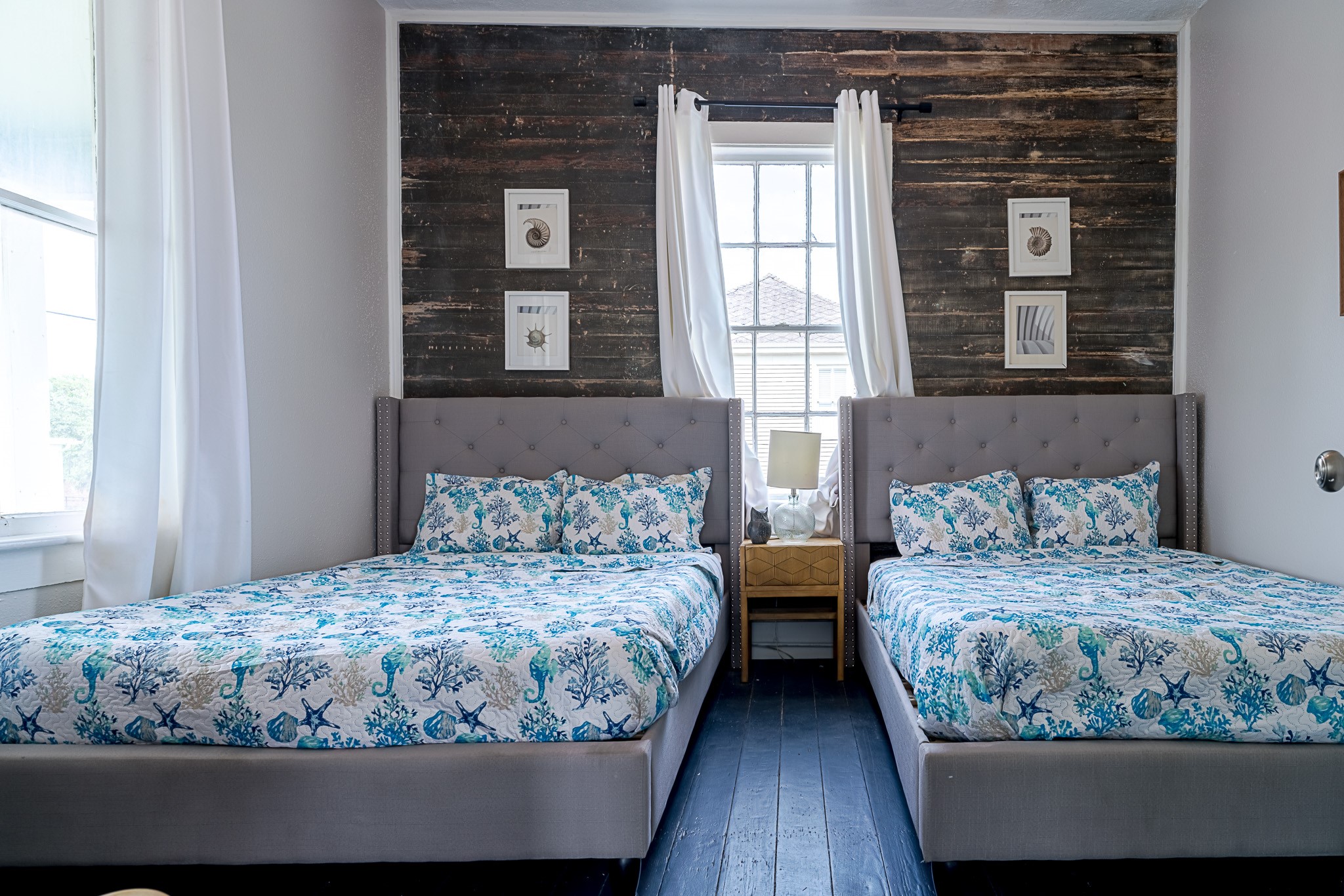 Bedroom one on the second floor, features two full beds