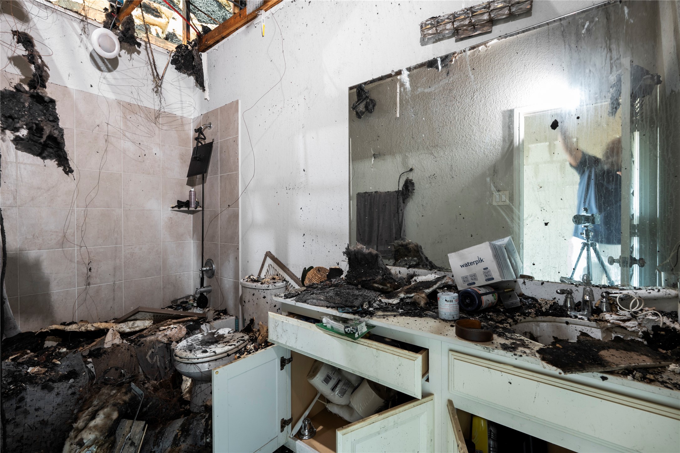 Fire damage shown in secondary bath.
