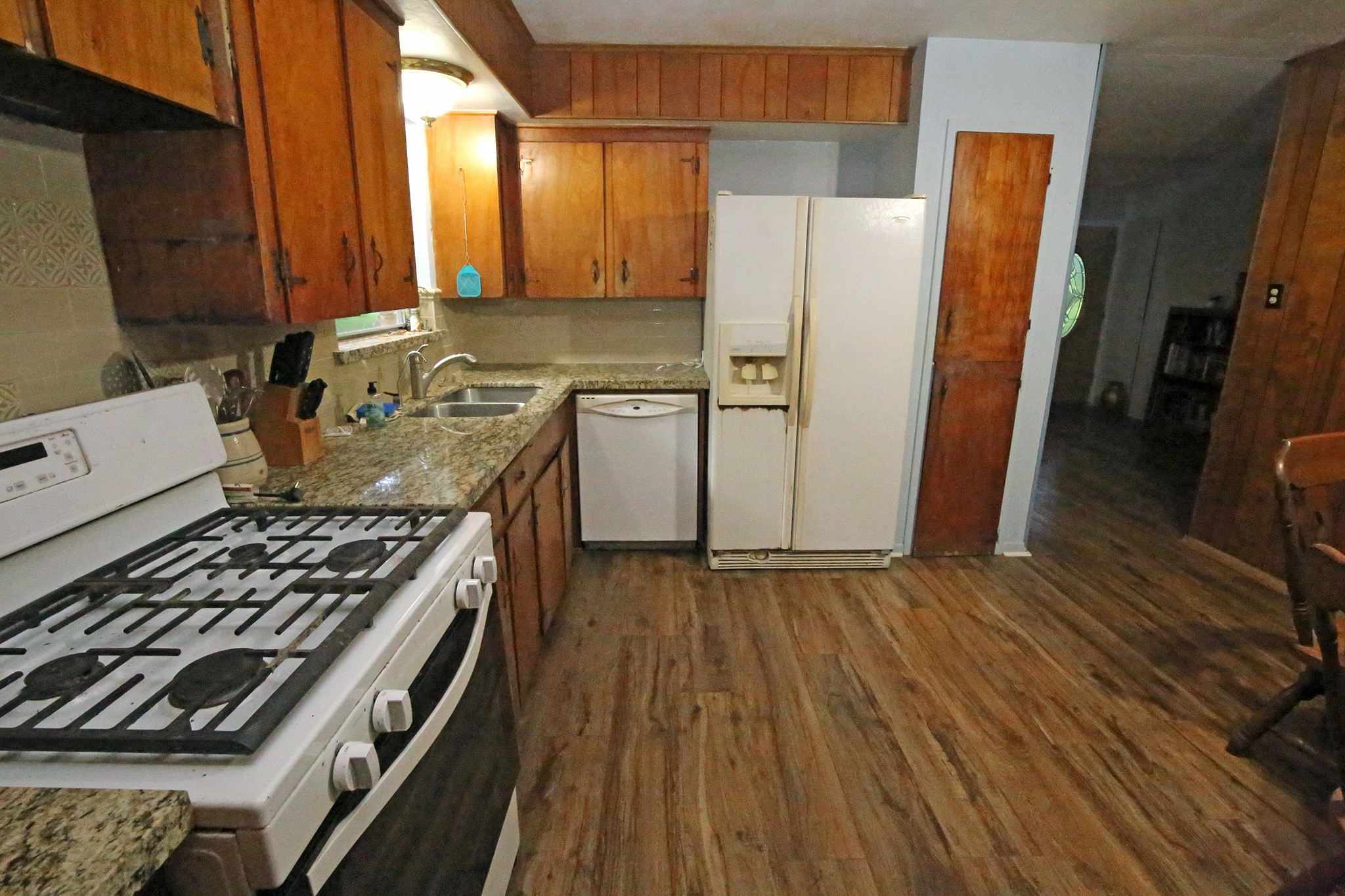 Kitchen with gas stove and refrigerator stays
