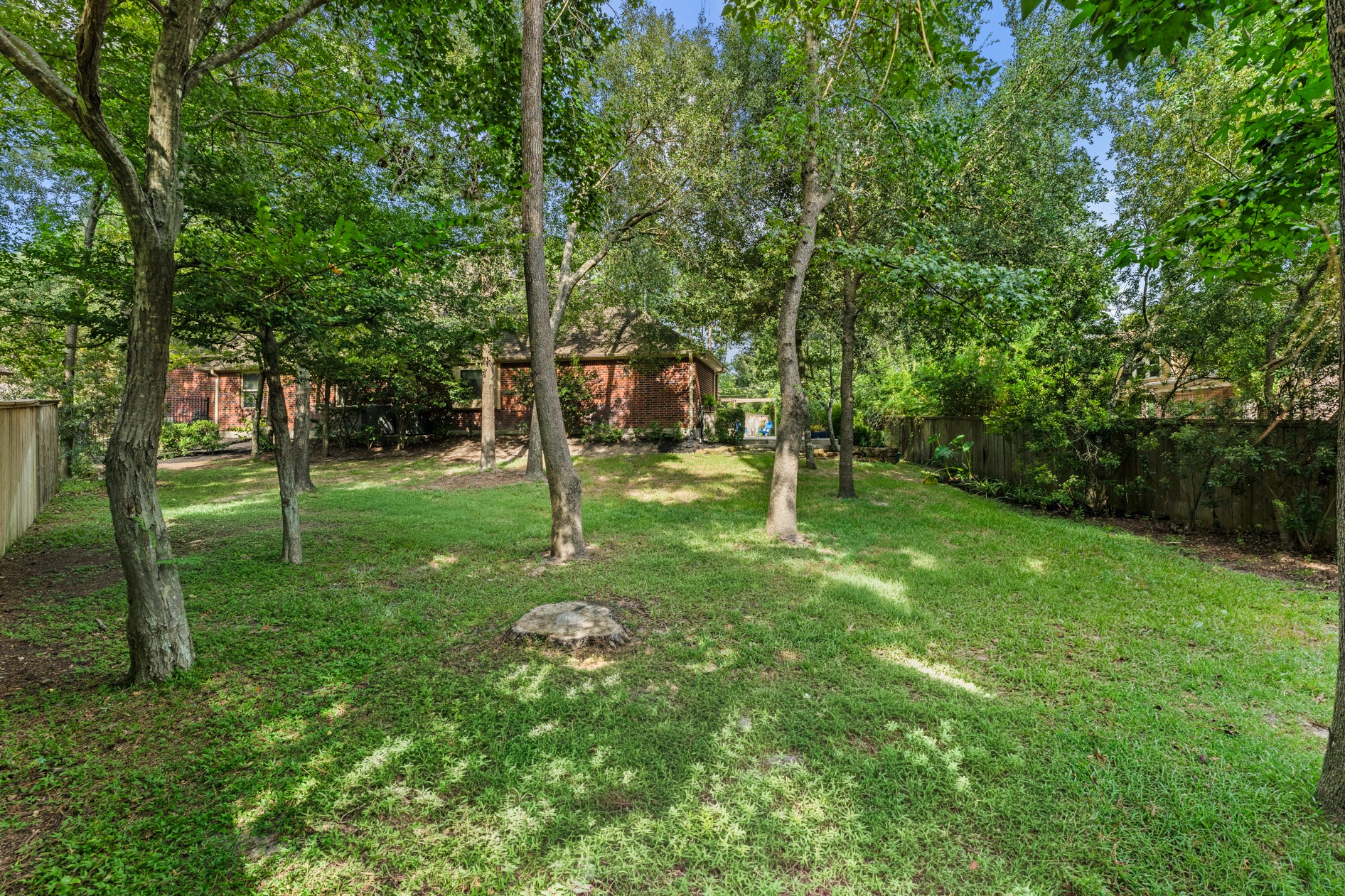 The park-like backyard has the perfect mix of trees and lawn area.  Plenty of room for people and pets to roam, garden, or play backyard games!