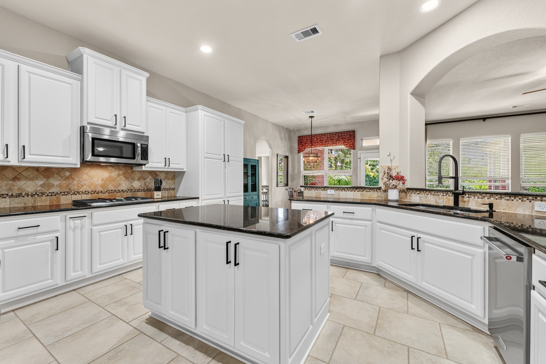 Long countertops and a center island make meal prep a breeze!