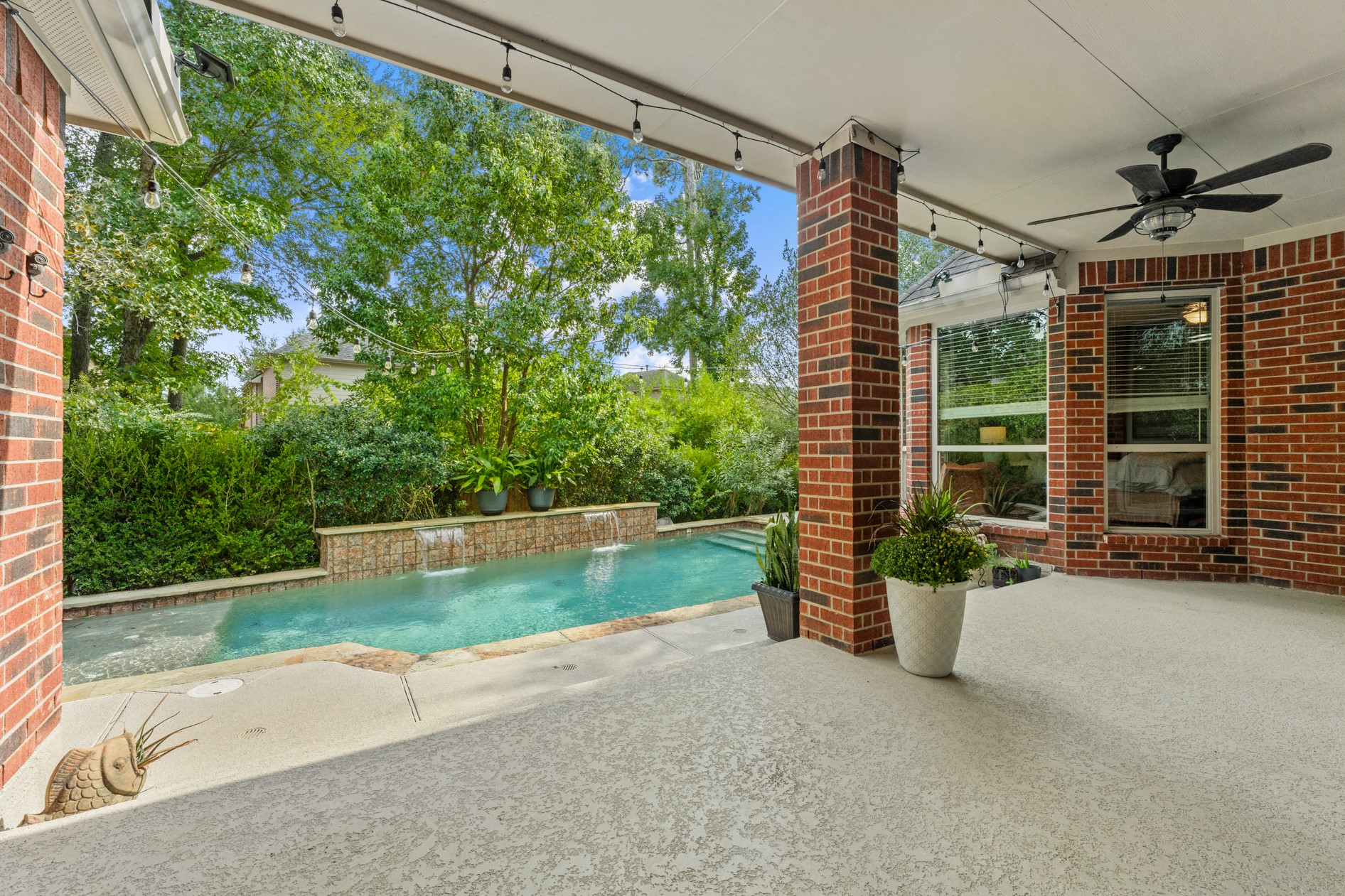 Step outside - your covered patio and gorgeous pool area is a wonderful space for your family and friends to truly enjoy the outdoors! The patio can accommodate a dining table and outdoor furniture.