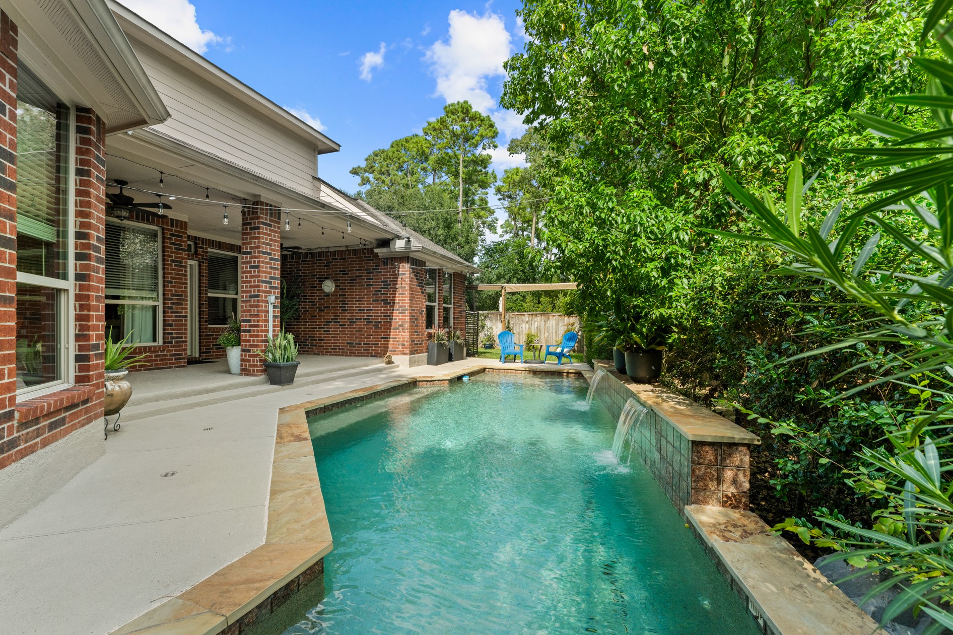 Mature lush landscaping provides a natural privacy screen.