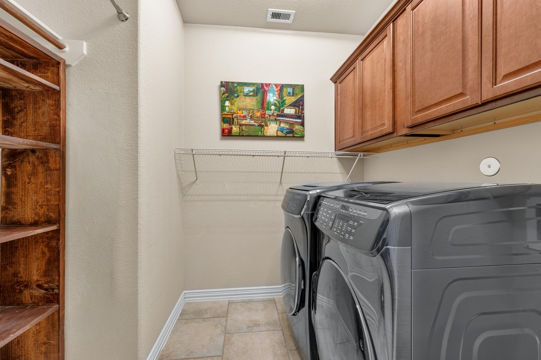 The laundry room provides additional storage for cleaning supplies, vacuums and more!