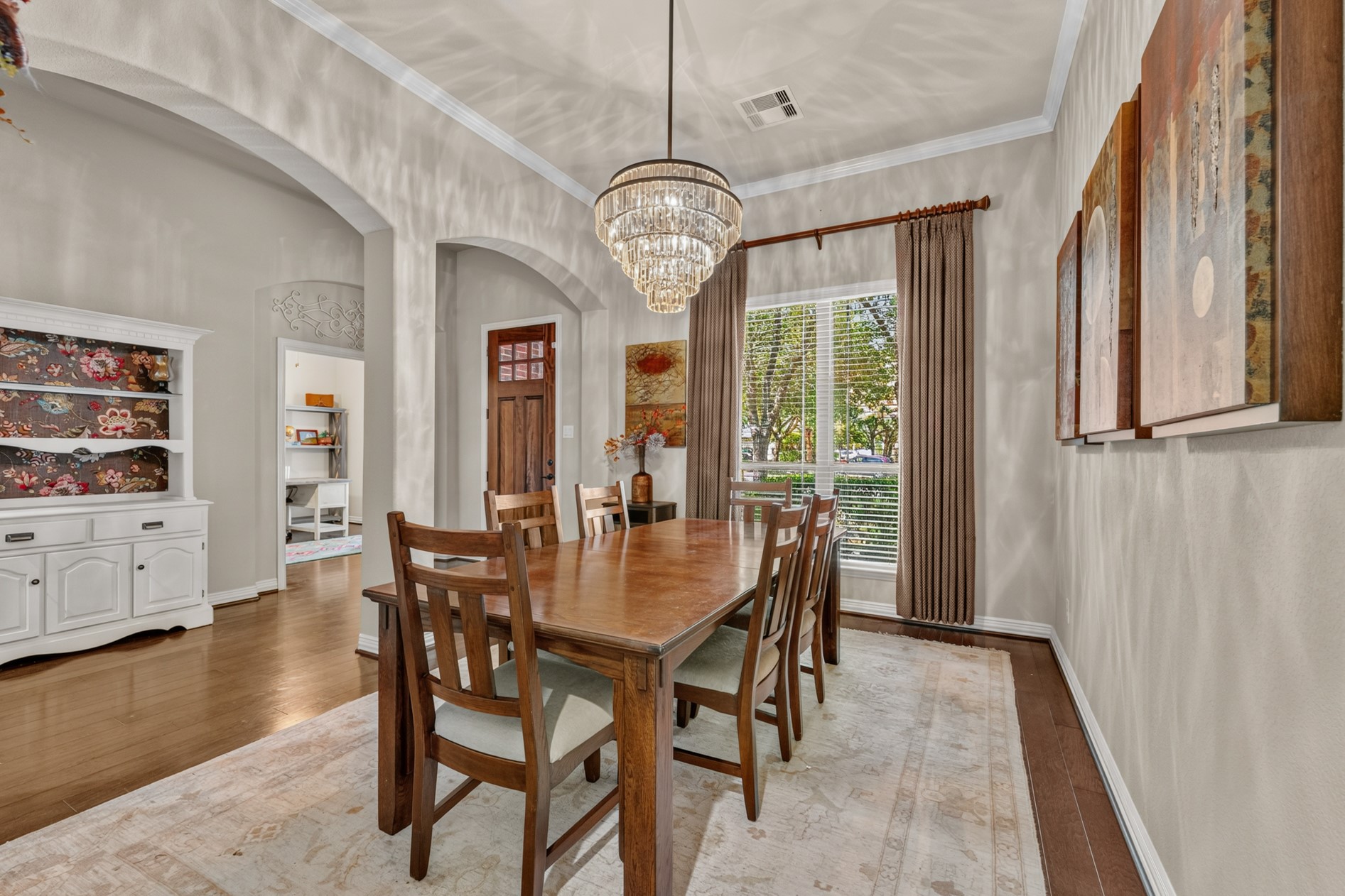 This dining room is the perfect spot to share meals with family and friends! A stunning chandelier serves as the focal point of the room.