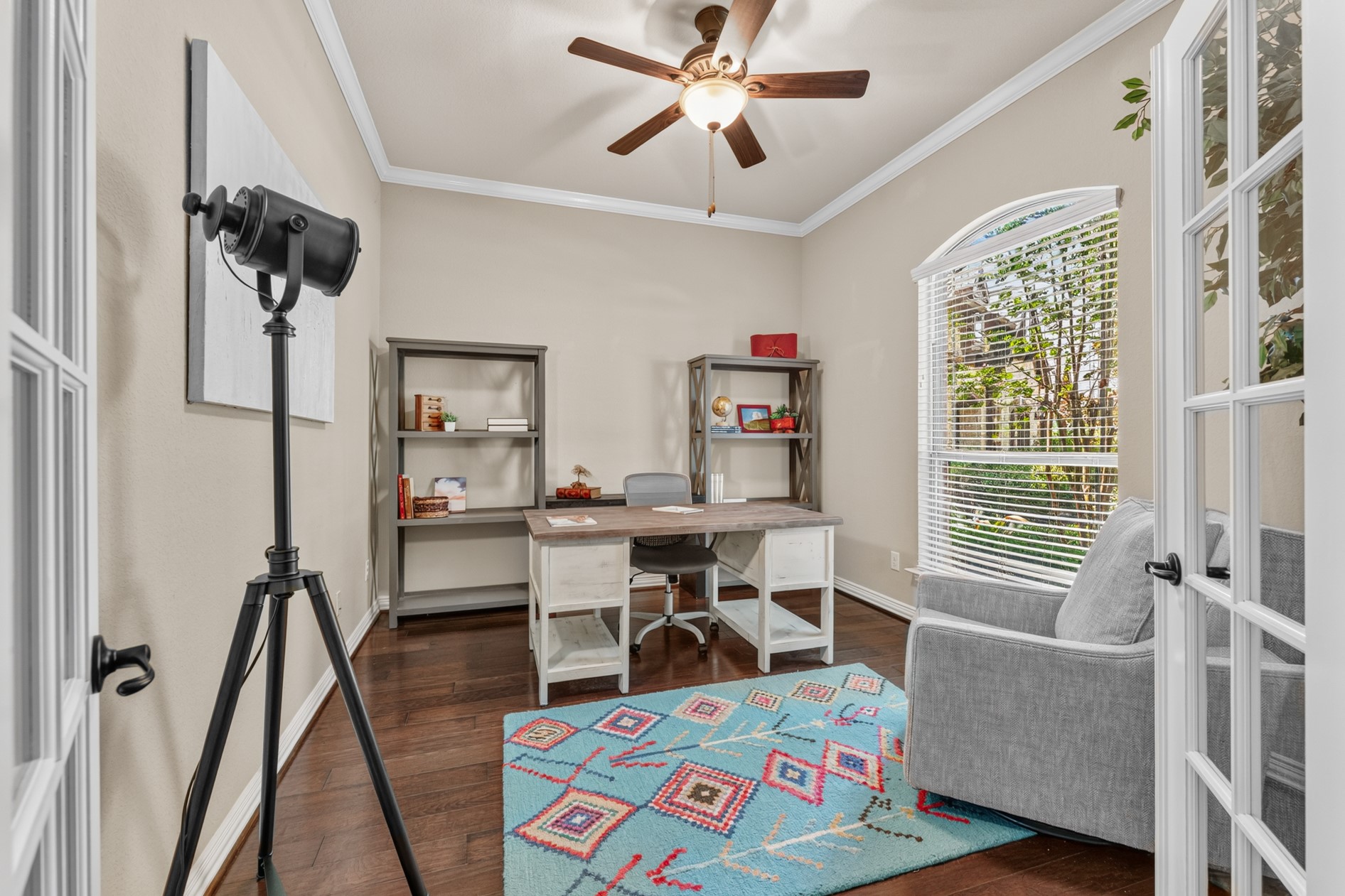 Located at the front of the home, the office provides a quiet space to work. French doors and a large arched window let natural light in. Enjoy a nice view of the front yard while you work!