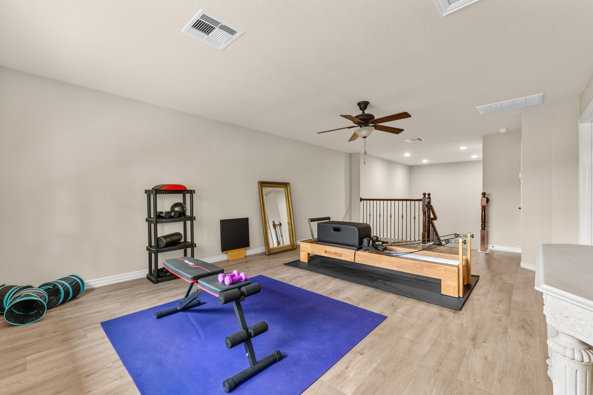 Game room currently being used as a home gym.