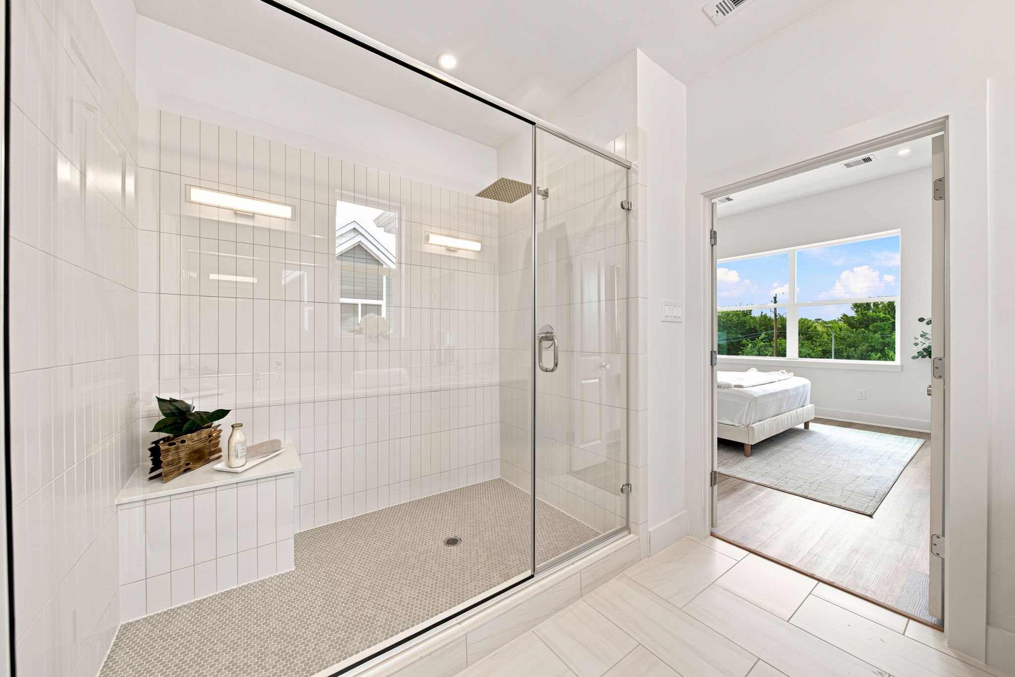 Large shower with sitting area.