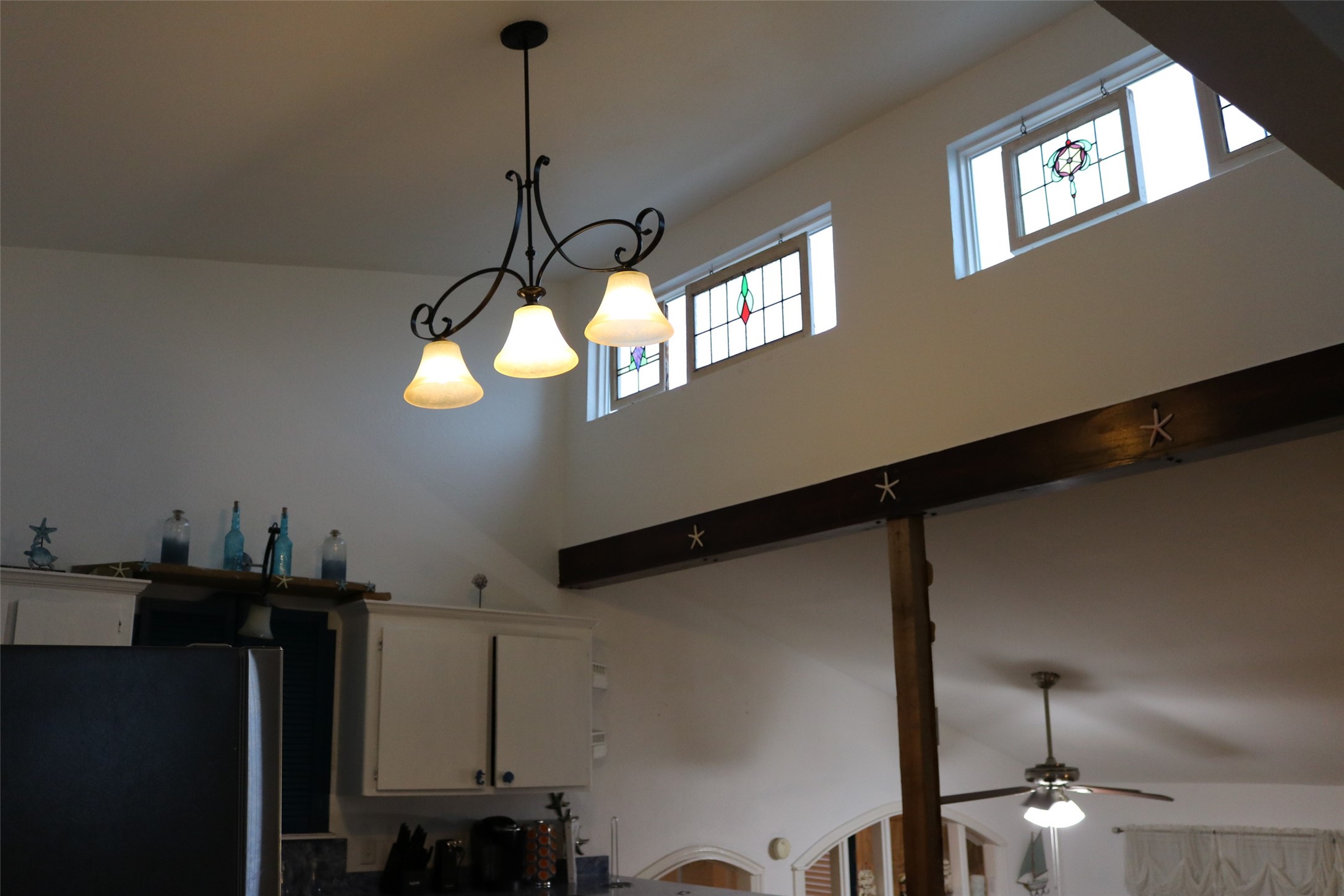 Elevate your culinary experience with stunning loft windows that flood the kitchen with natural light.