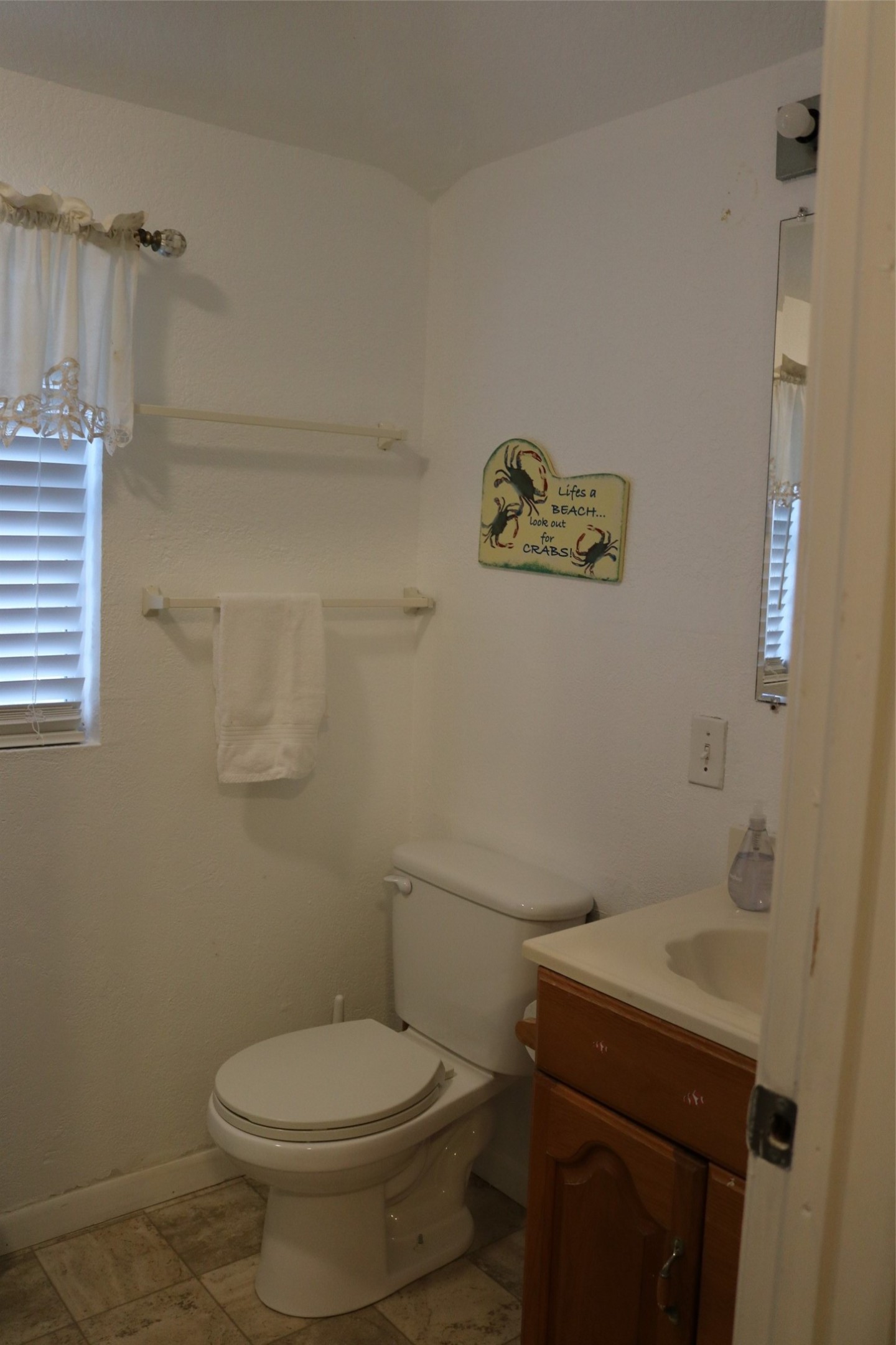 Charming ensuite bathroom for the third-level guest room.