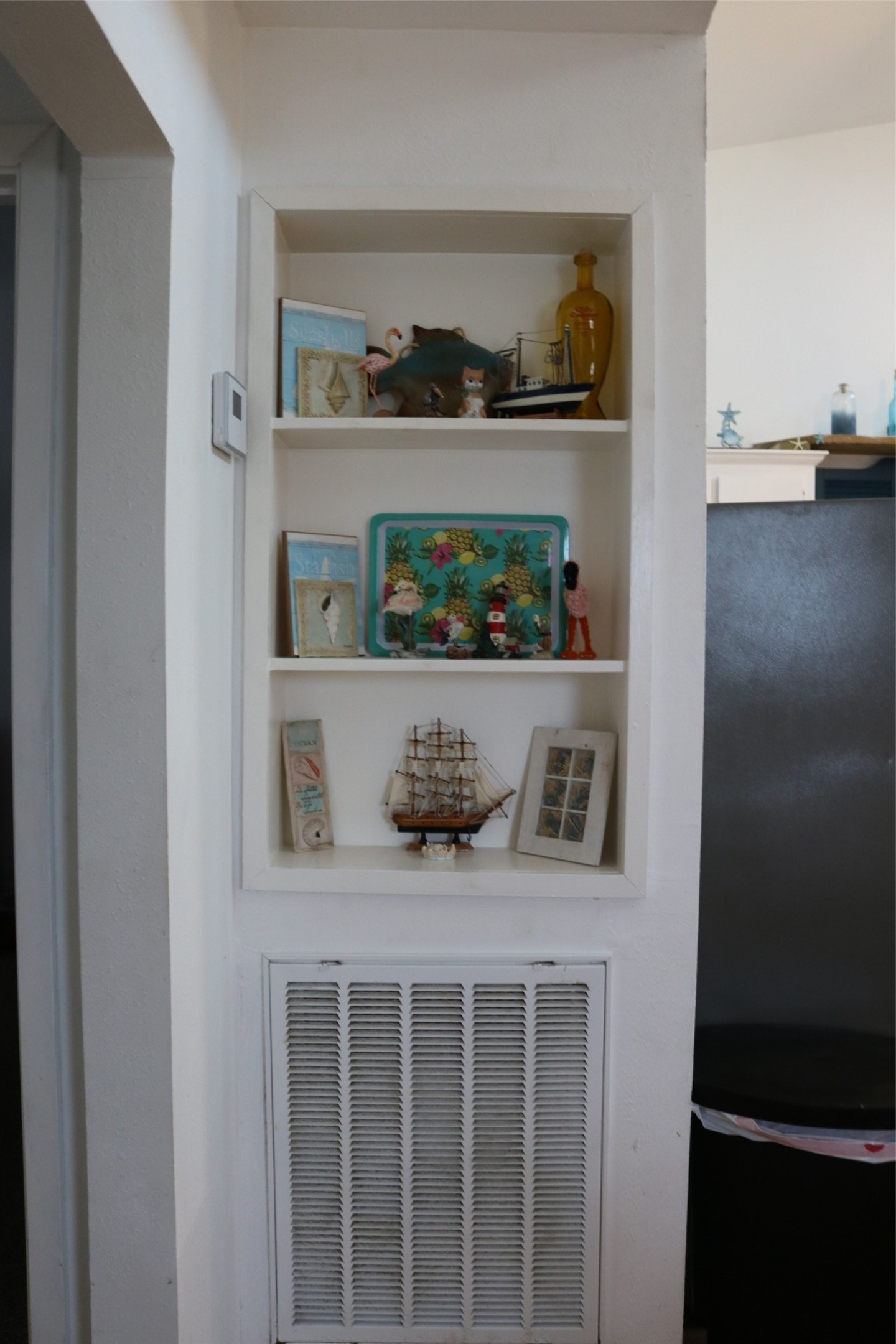 Cozy kitchen nook with built-in shelving for added charm and storage.