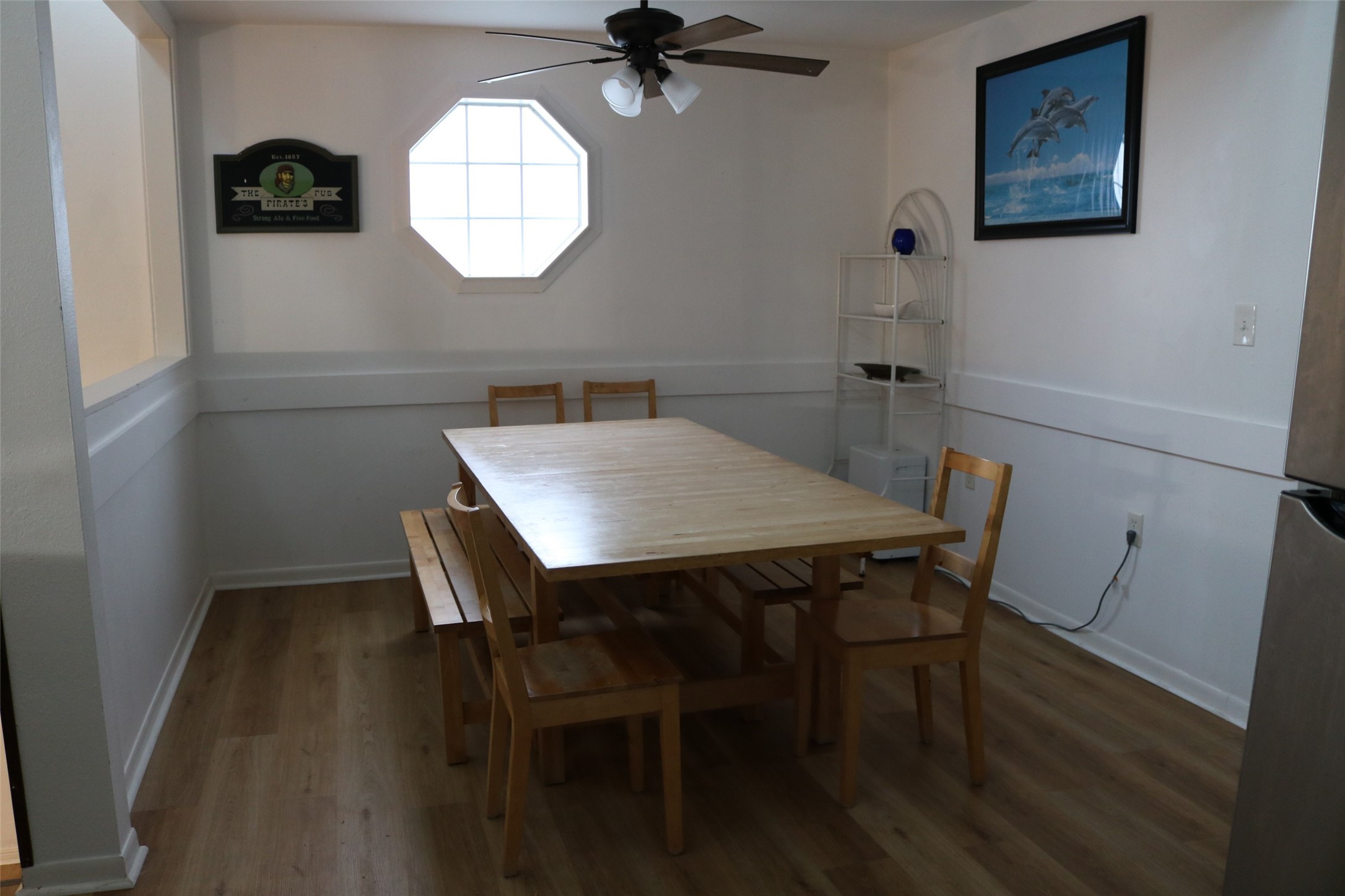 Bright dining area adjacent to the kitchen, featuring a cozy setting with ample natural light.