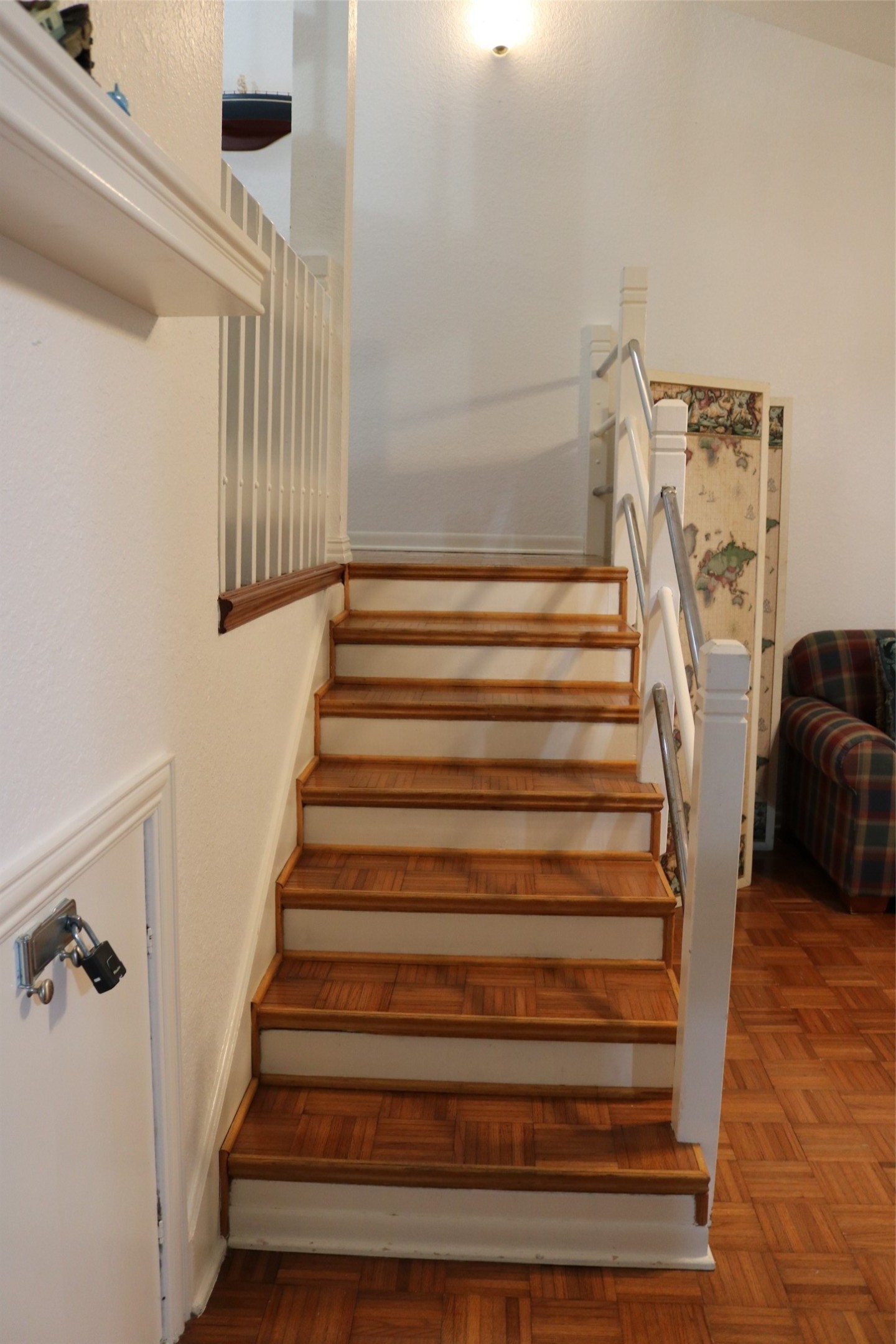 Ascend from the cozy den/library to the master suite on the second level, featuring a bathroom and a spiral staircase leading to the third level.