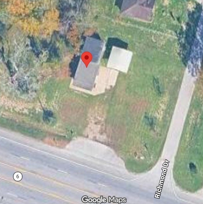 Experience a prime location with this bird's-eye view of a charming home nestled on a lush, spacious corner lot, offering easy access to Richmond Drive and Highway 6. Experience a prime location with this bird's-eye view of a charming home nestled on a lush, spacious corner lot, offering easy access to Richmond Drive and Highway 6.