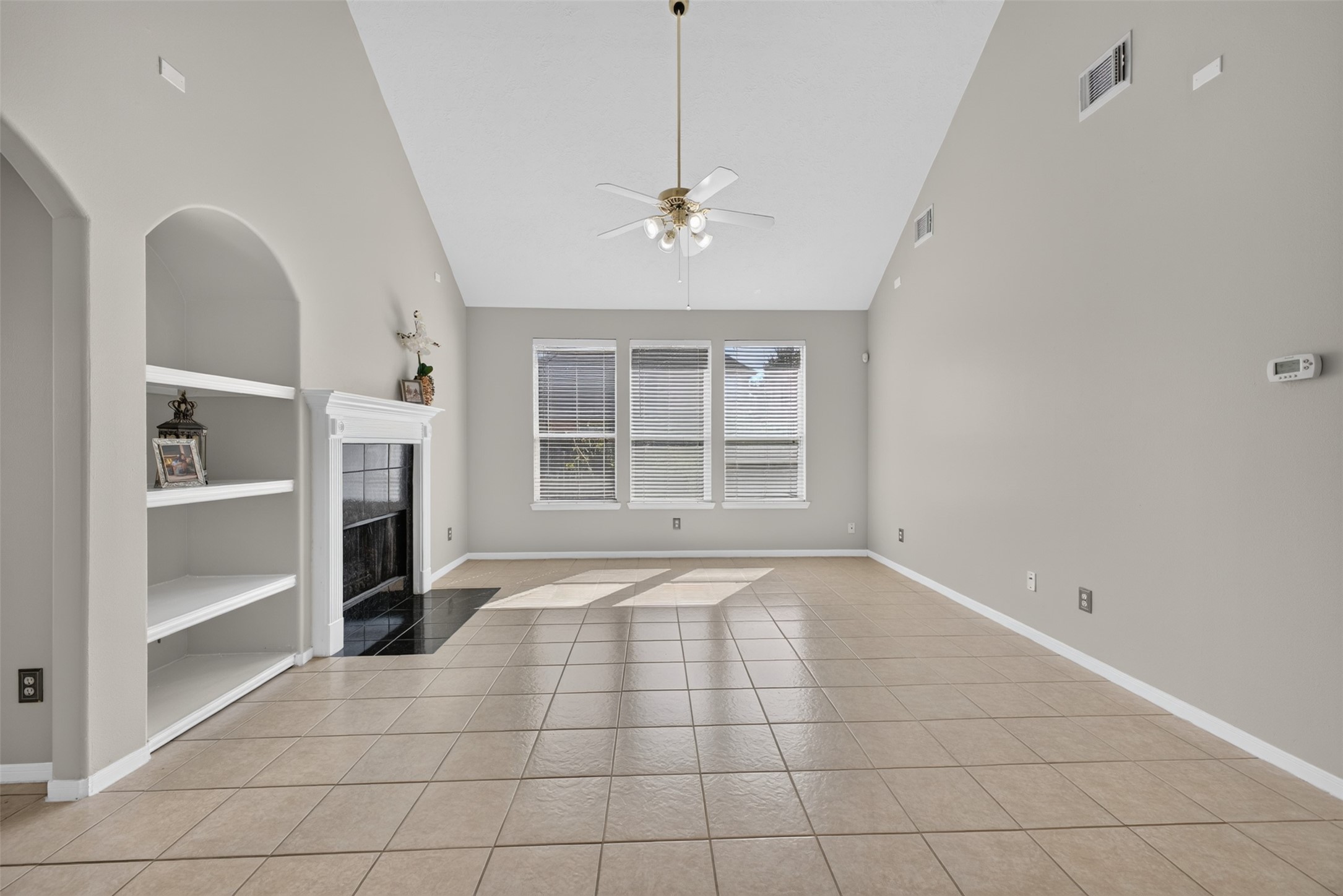 Formal Living with built in shelves and fireplace
