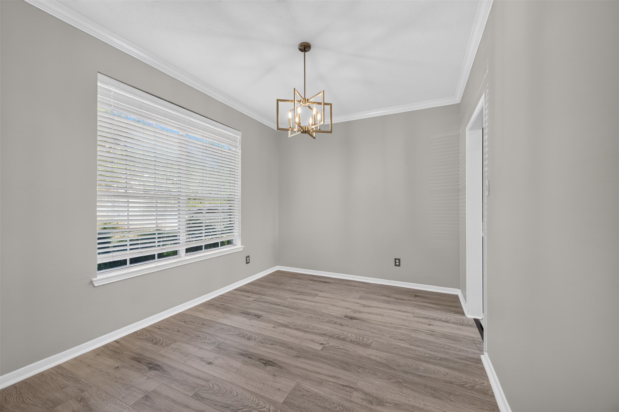 Formal Dining with updated flooring and fixture