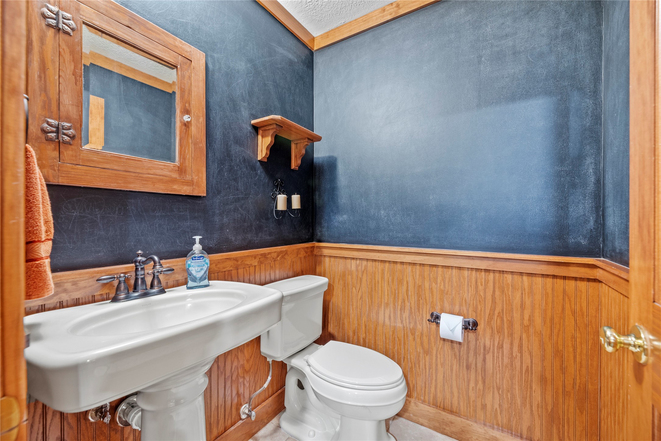 Half bathroom in the upstairs game room.