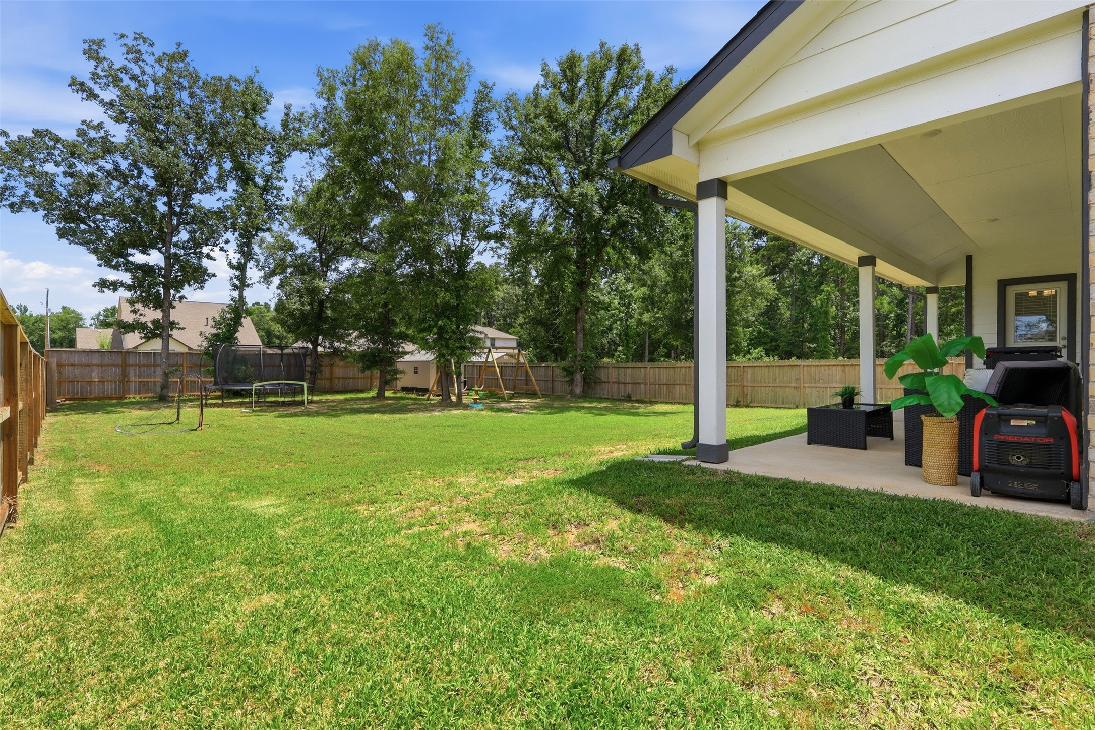Oversized backyard with mature shade trees, and room for a pool, workshop, guest house, play area, or RV/boat storage. Designed for outdoor living and endless possibilities.