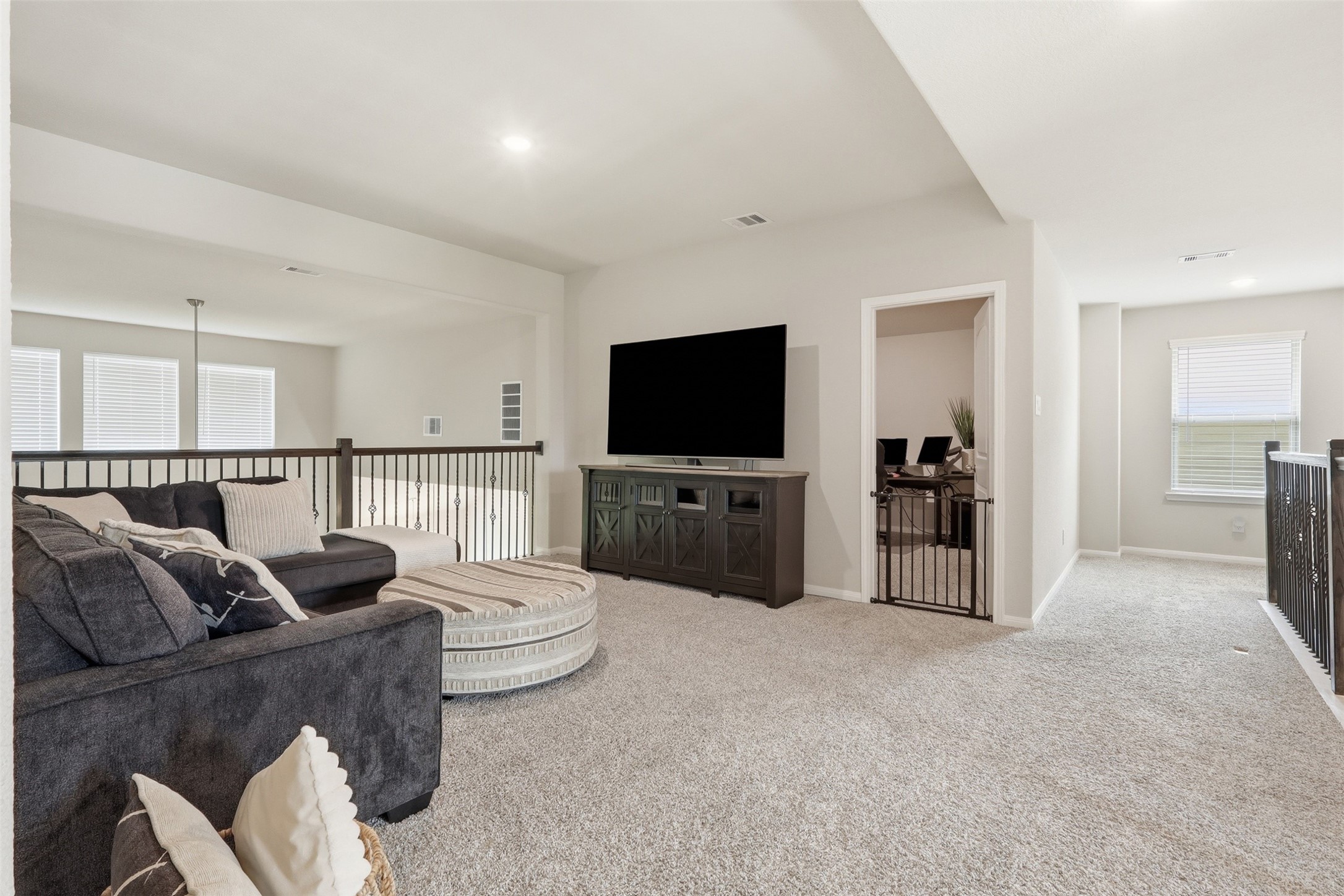 Centrally located game room adjacent to the media room and upstairs bedrooms, creating the perfect space for entertainment and family gatherings.