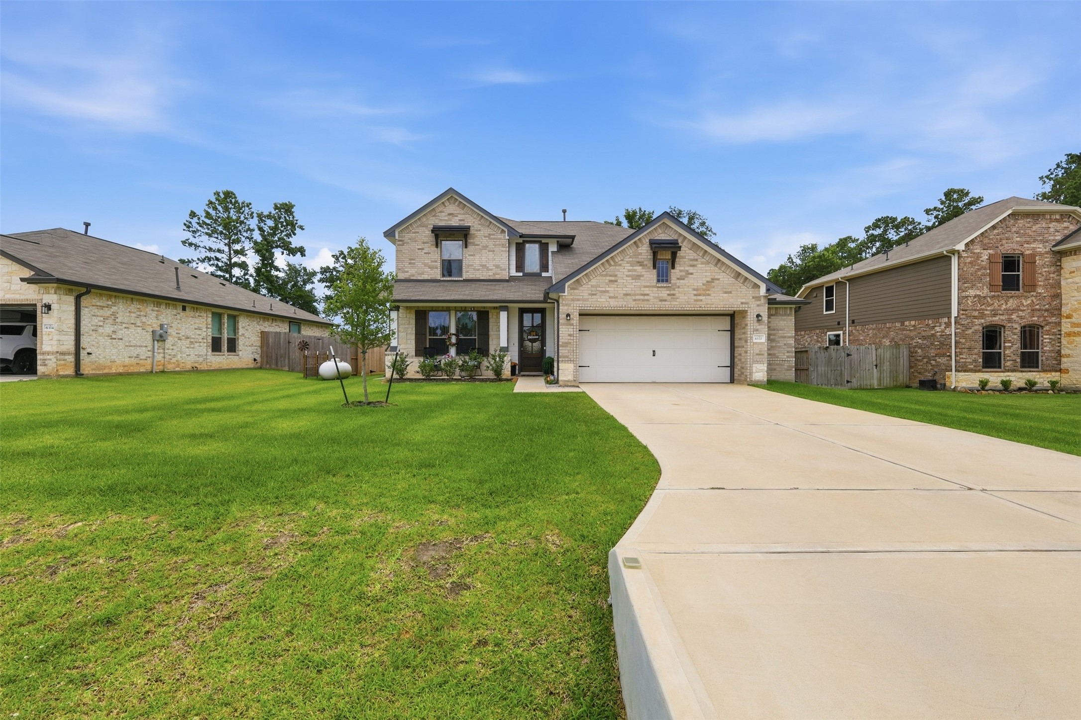 Extra-wide driveway provides ample parking for family and guests.
