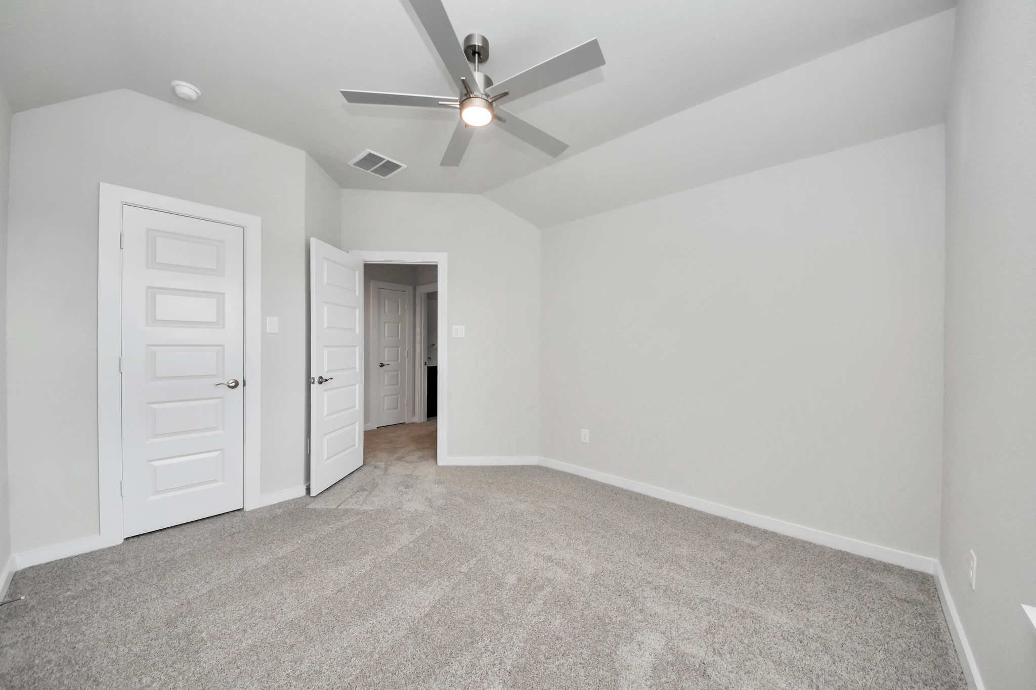 Generously sized secondary bedrooms featuring spacious closets, soft and inviting carpeting underfoot, large windows allowing plenty of natural light, and the added touch of privacy blinds for your personal retreat. Sample photo of completed home with similar floor plan. Actual colors and selections may vary.