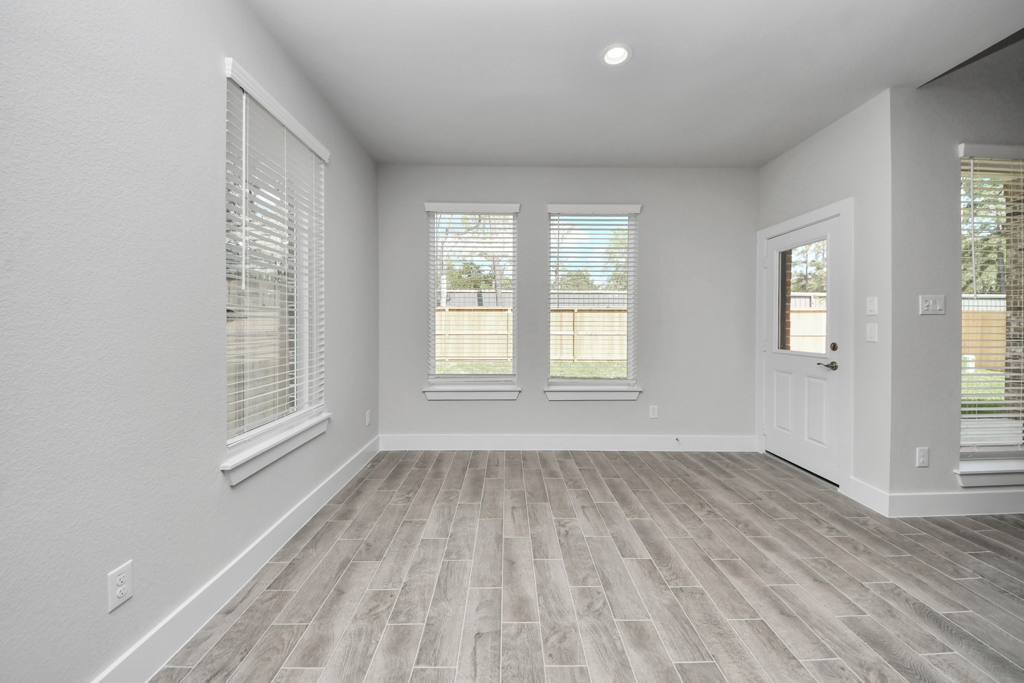 Enjoy breakfast with ease in the connected and cozy breakfast area, seamlessly integrated with the kitchen for utmost convenience. Step through the back door for a breath of fresh air onto the covered patio, extending your living space to the outdoors. Sample photo of completed home with similar floor plan. Actual colors and selections may vary.