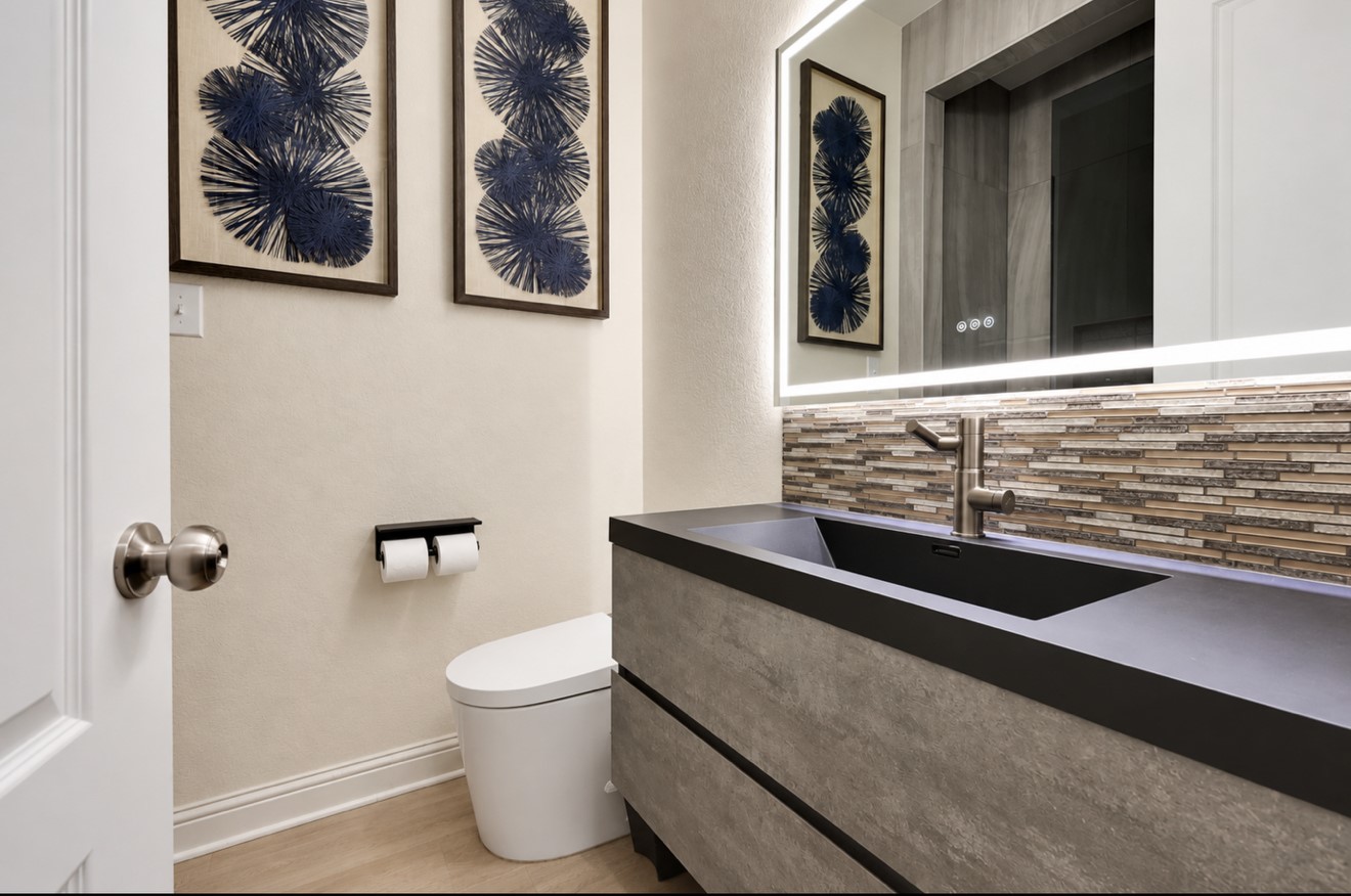 Converted the downstairs half bathroom into a full bathroom with a walk-in shower.
