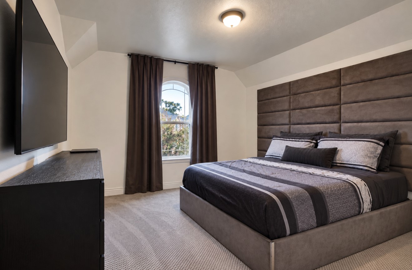 Inviting upstairs bedroom ideal for family or guests. A fully renovated Jack-and-Jill bathroom connects this room to the adjacent bedroom, offering convenient shared access.
