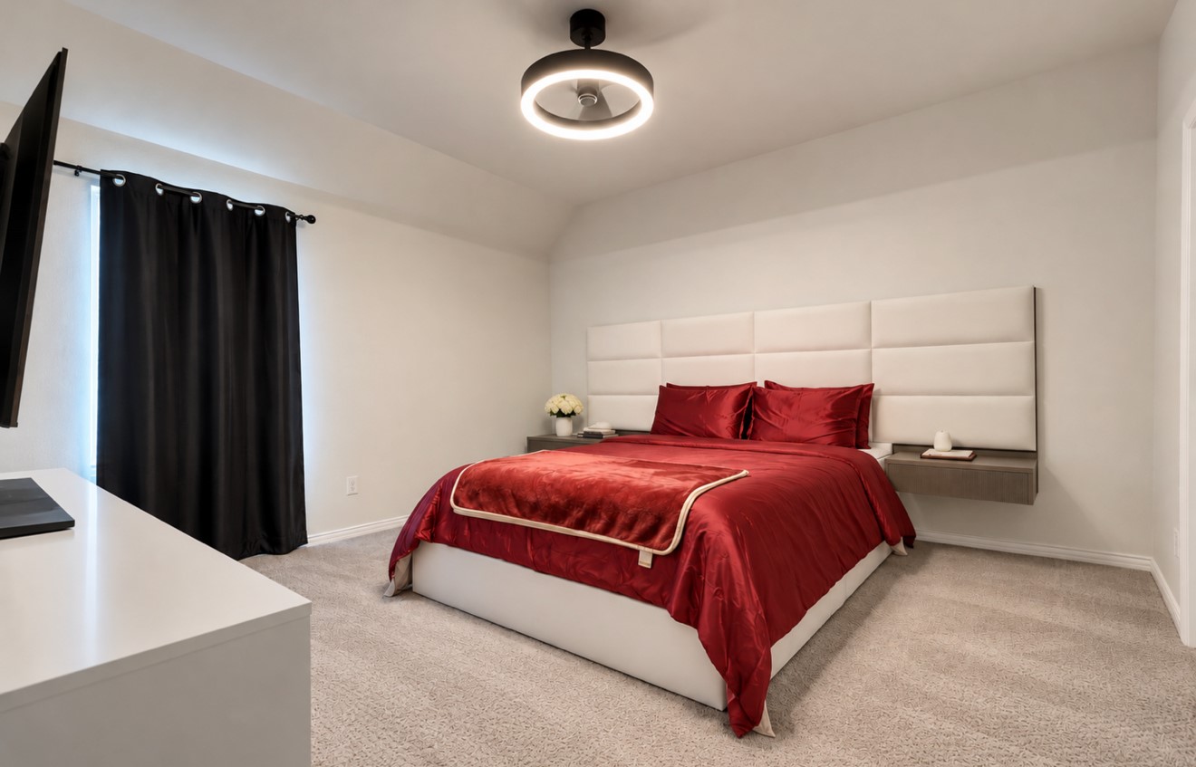 Inviting upstairs bedroom ideal for family or guests. A fully renovated Jack-and-Jill bathroom connects this room to the adjacent bedroom, offering convenient shared access.
