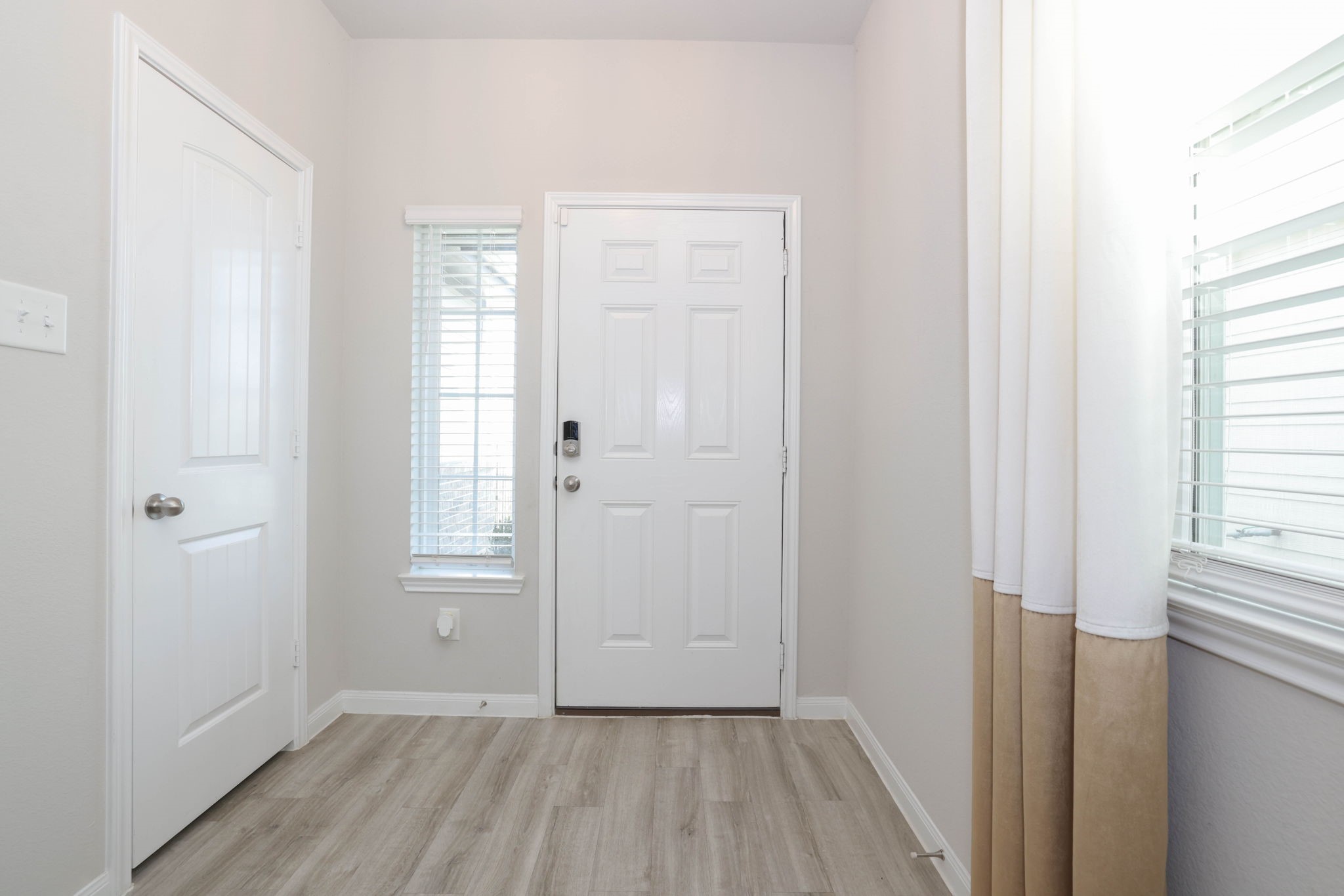 Coat closet in front entry way.