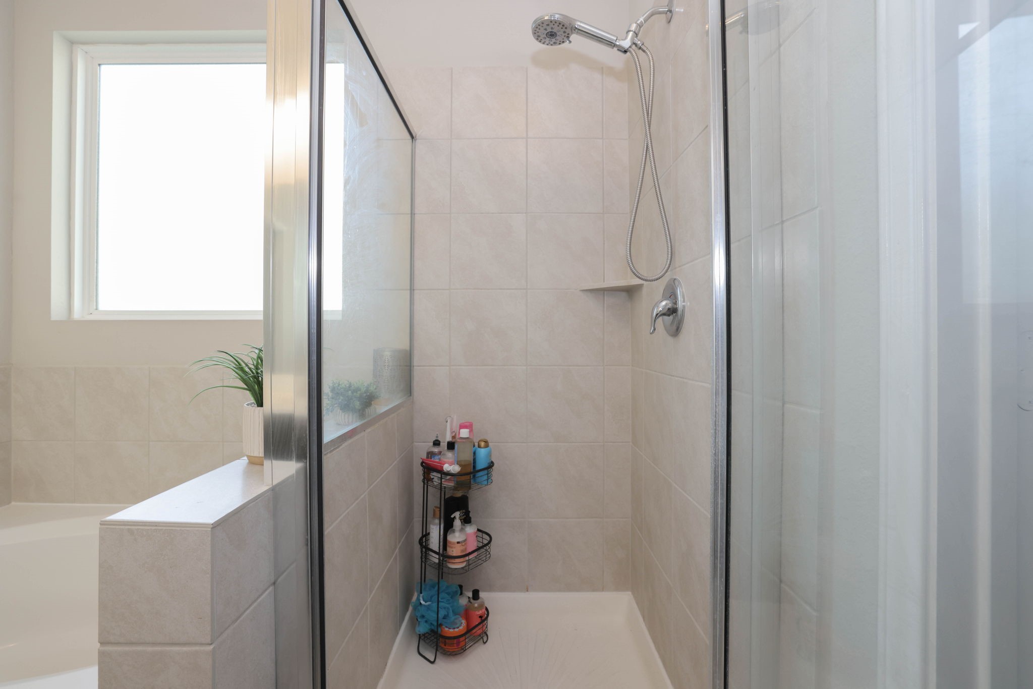 Glass enclosed shower.