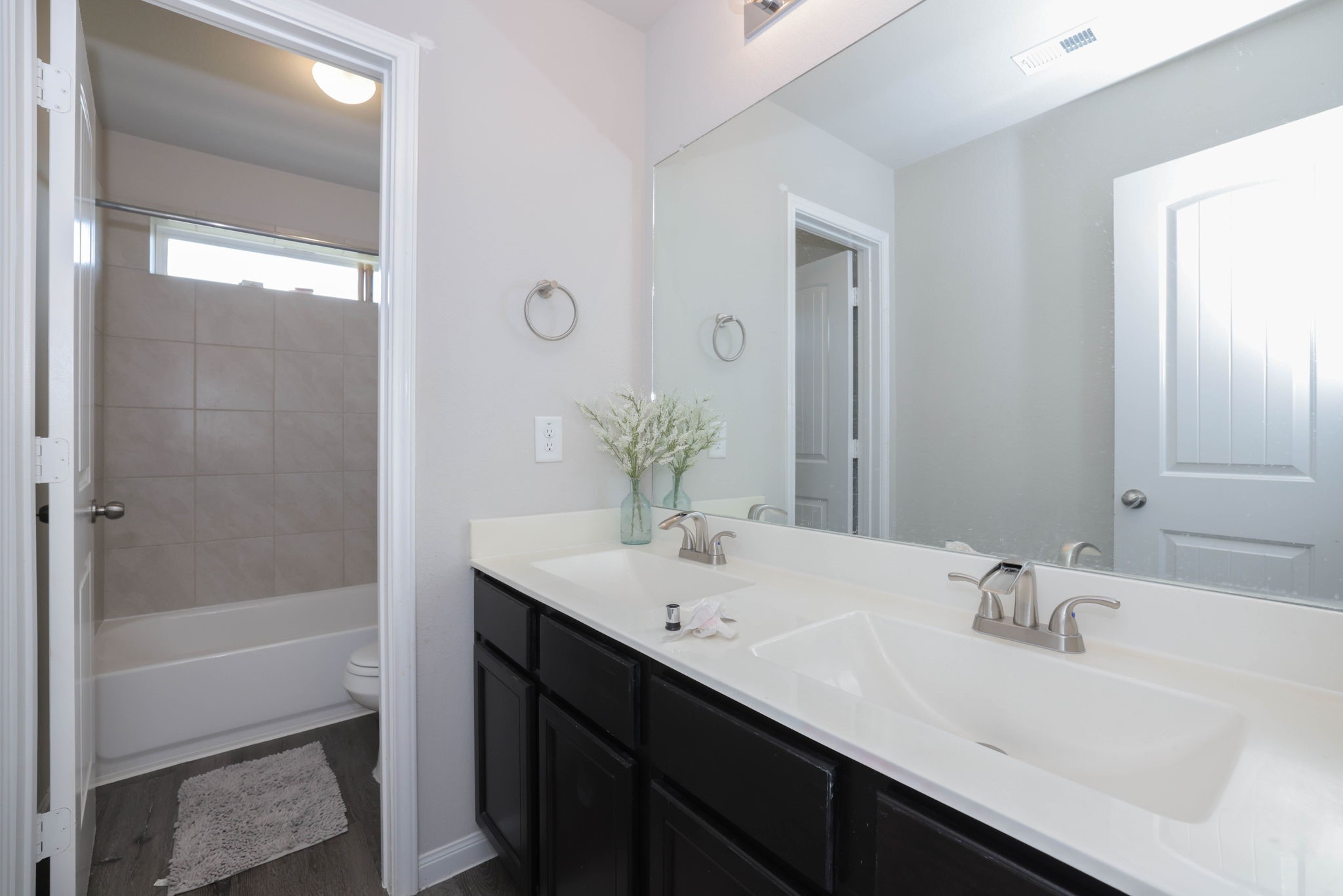 Full bathroom located on 2nd floor has double sinks.