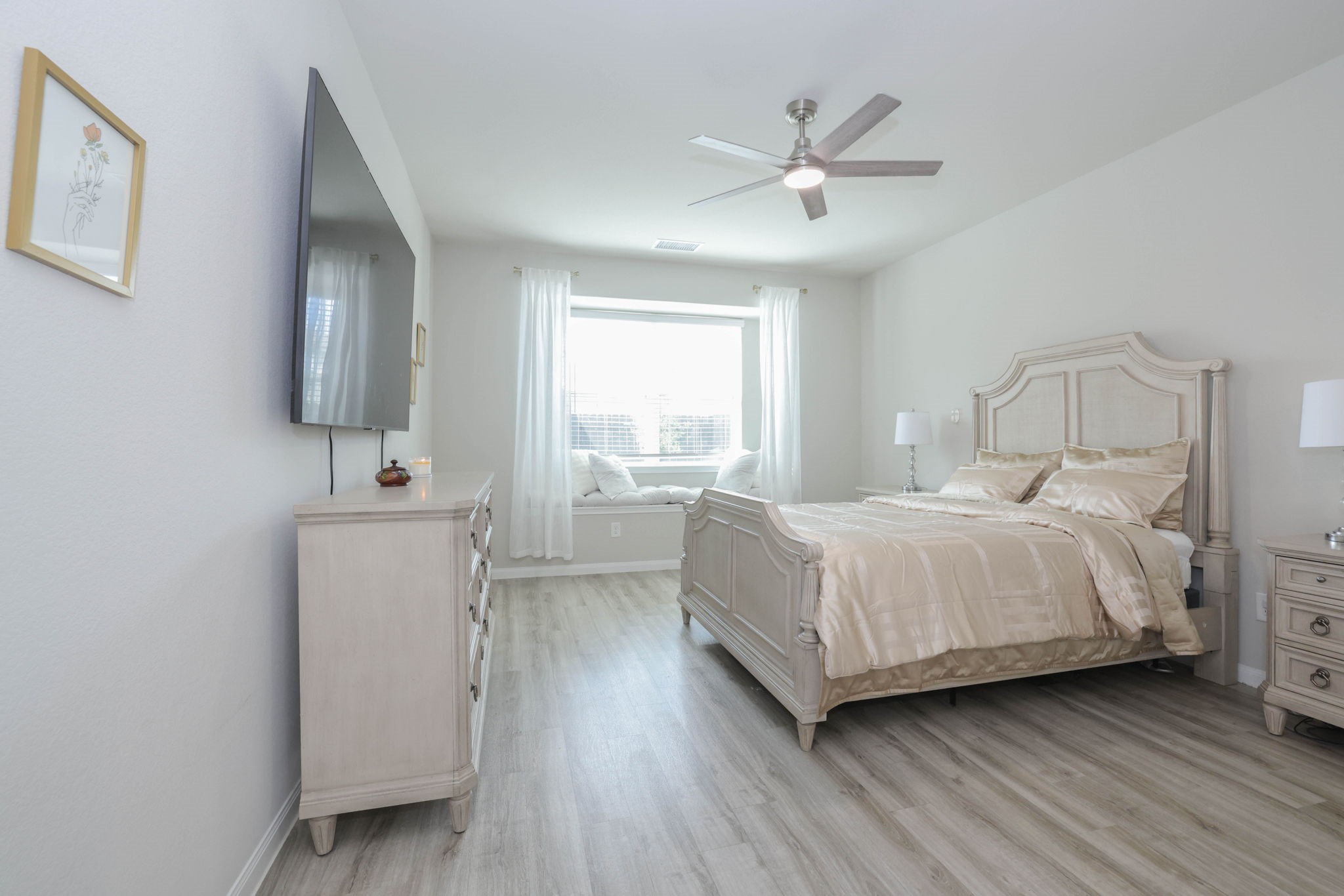 Spacious Primary bedroom with window seat.